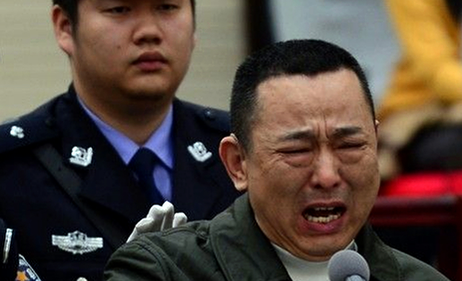 The look of despair on Liu Han's face revealed his pain as he heard the court's verdict. SCMP Pictures