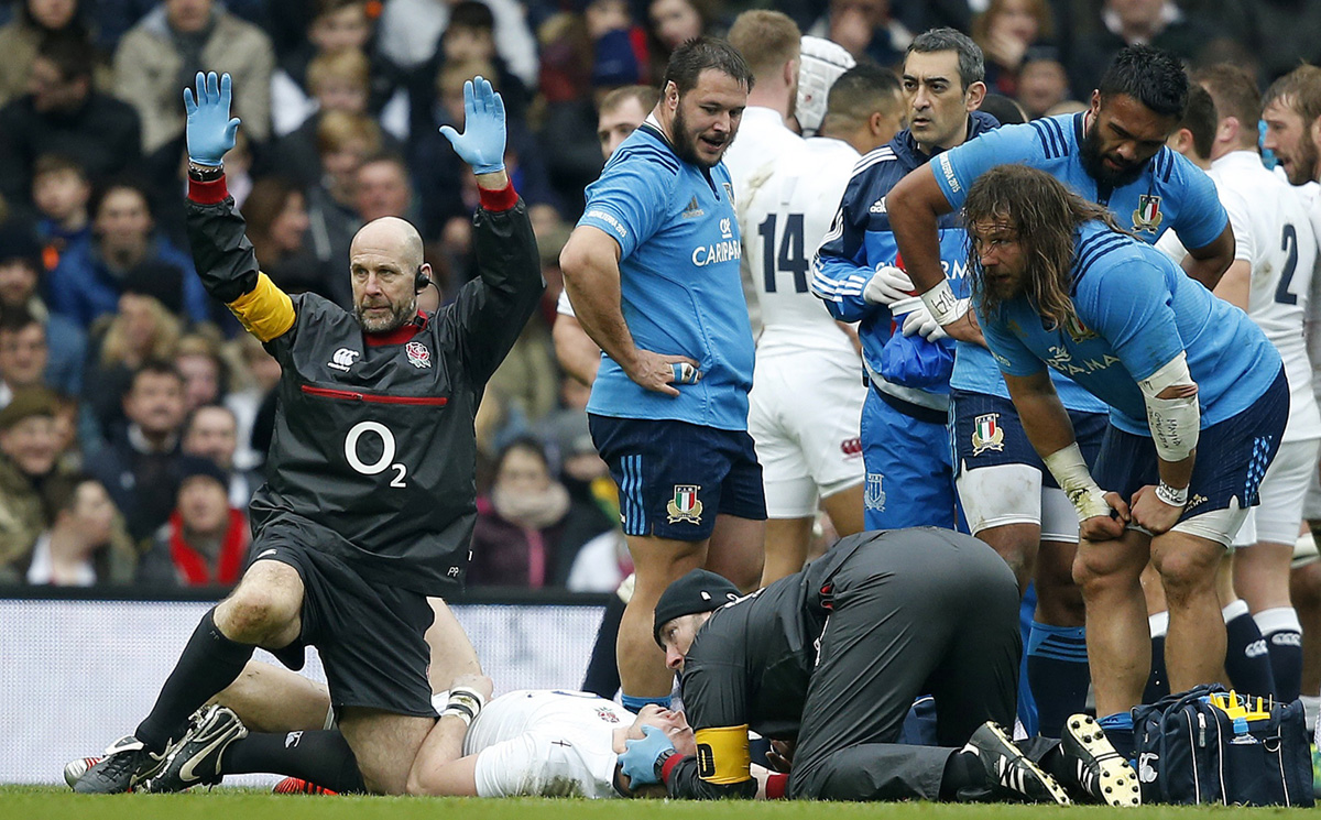 Medics call for a stretcher as England’s injured fullback Mike Brown lays motionless 12 minutes into Saturday’s Six Nations match against Italy. Photo: AP