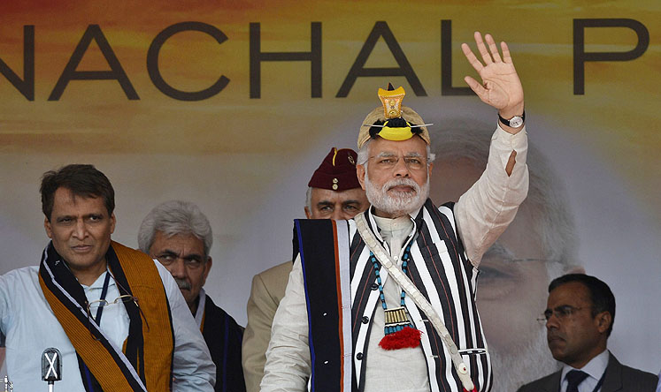 Prime minister of India Narendra Modi waves during his visit to the disputed state of Arunachal Pradesh on Friday. Photo: EPA