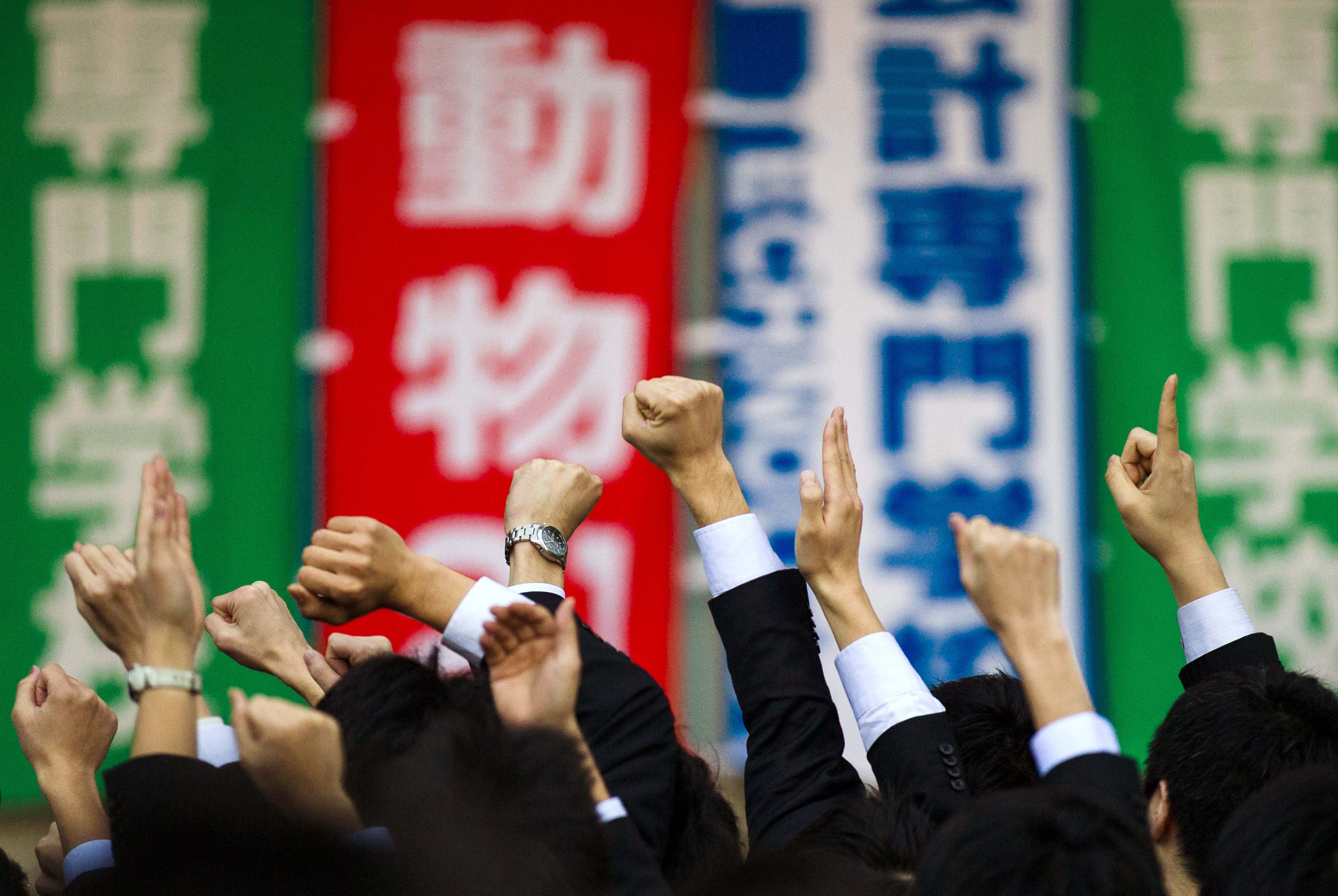 Japanese college graduates attend a rally intended for job seekers. After nearly two decades of recession, Japan's economy is growing again. Photo: Reuters