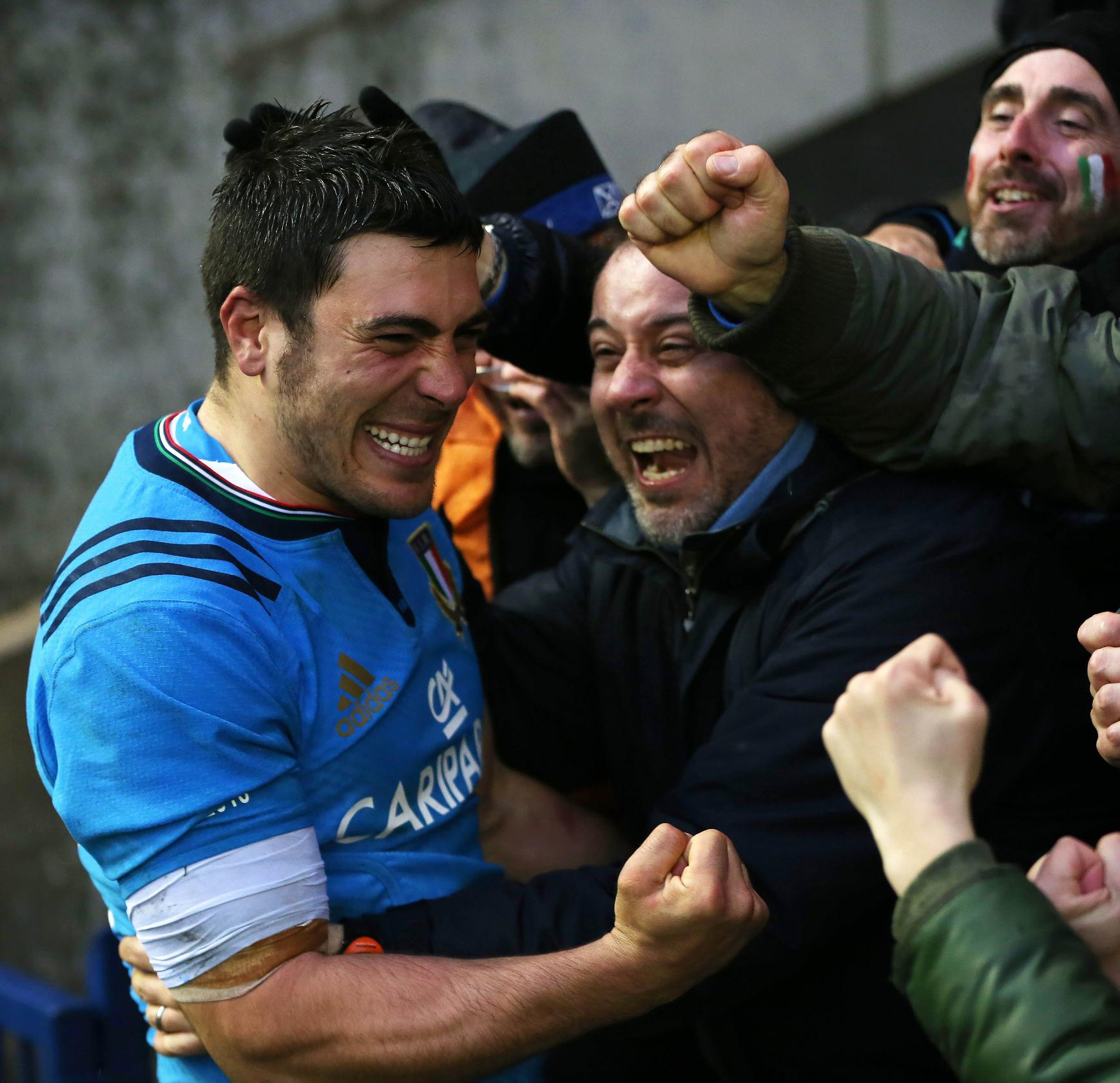 Italy scrum-half Edoardo Gori celebrates with fans at full-time in their Six Nations win against Scotland. Photo: AFP