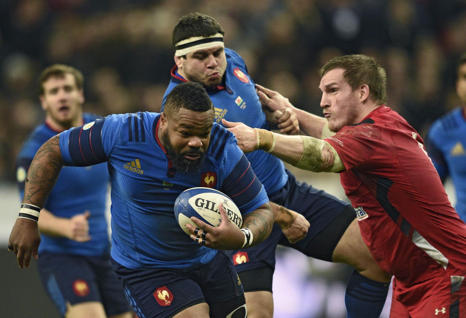 Burly France centre Mathieu Bastareaud brushes off Wales' Gethin Jenkins in their Six Nations match in Paris. Wales won 20-13. Photo: AFP