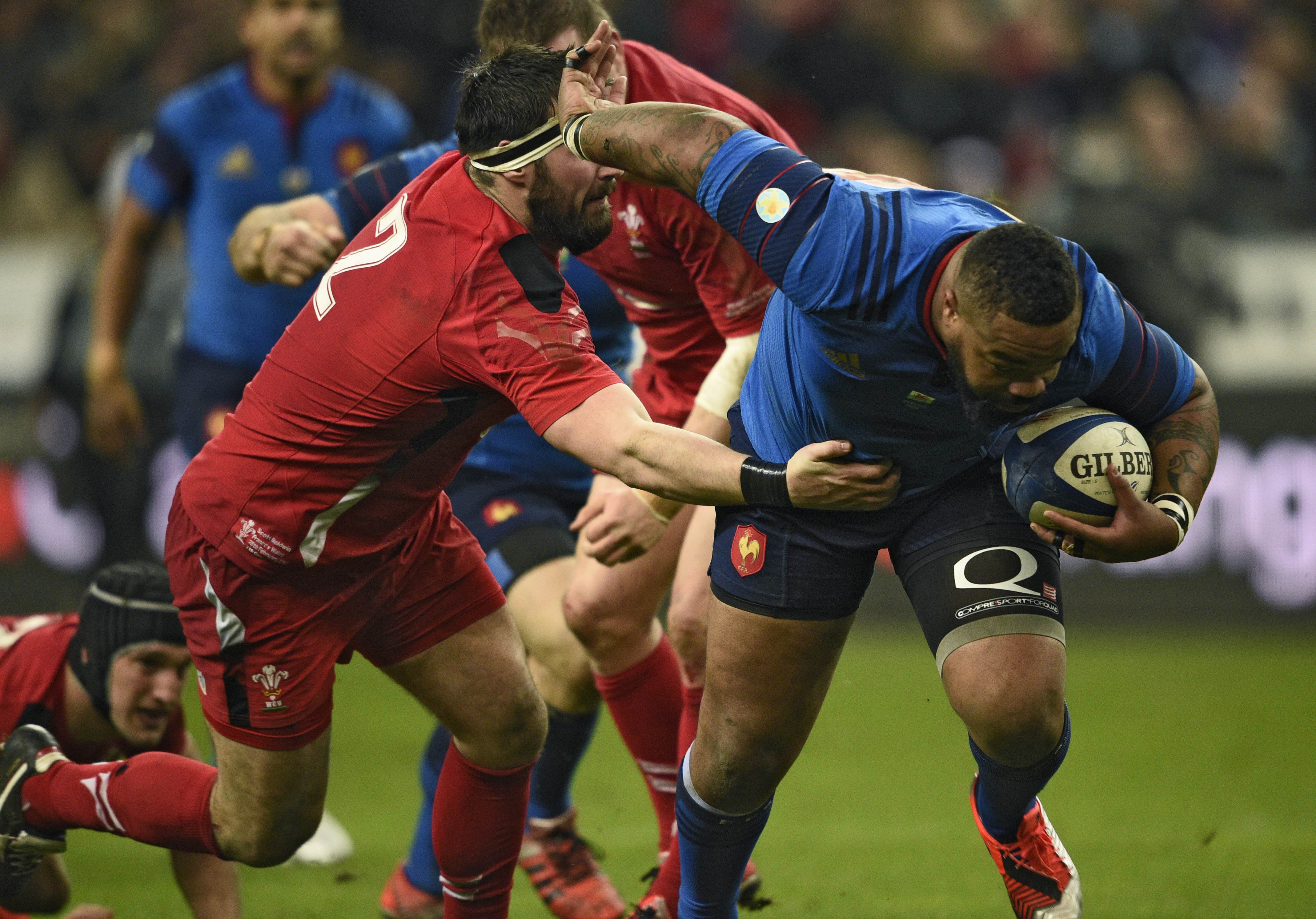 France's Mathieu Bastareaud evades a tackle by Scott Baldwin of Wales. Photo: AFP
