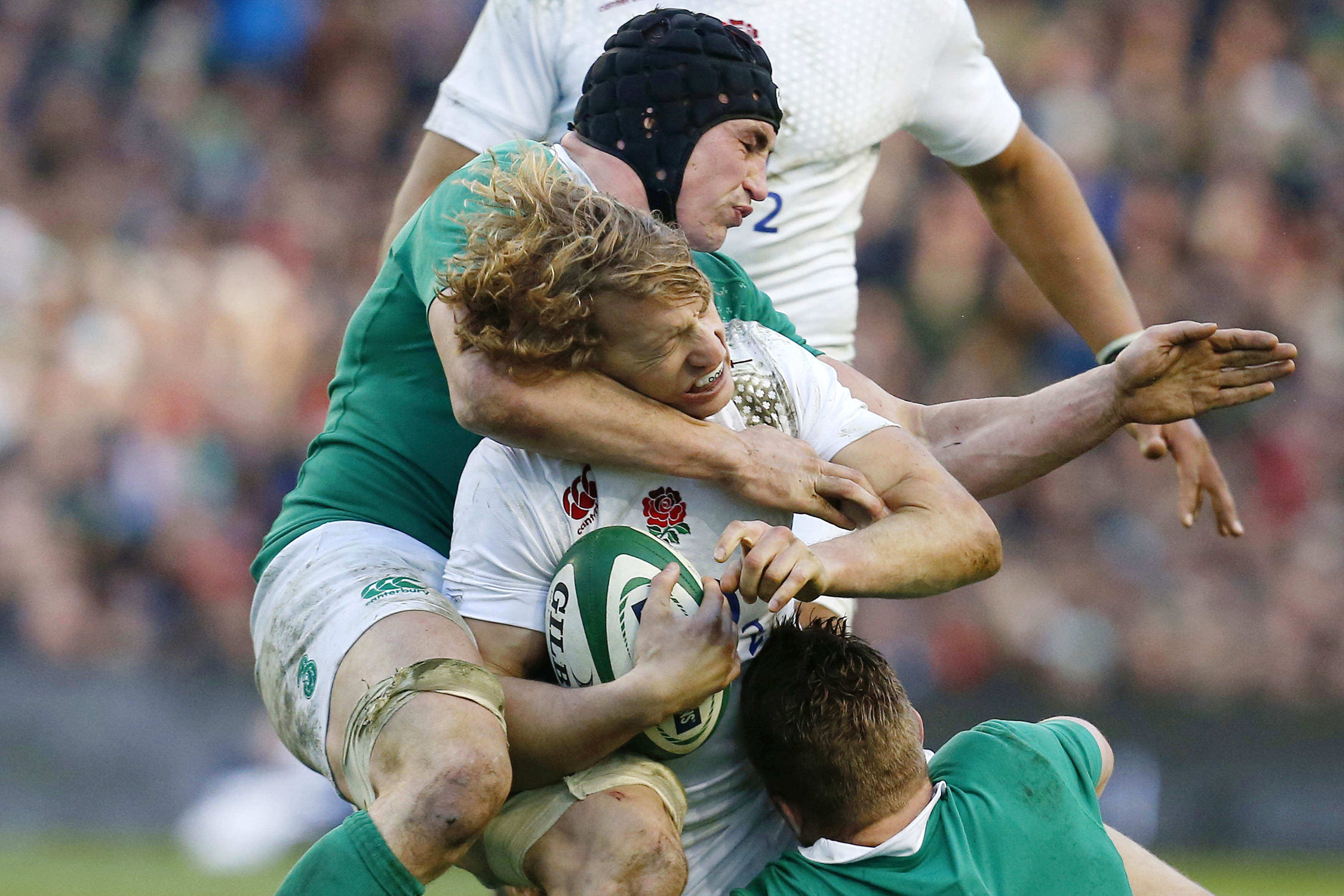 England's Billy Twelvetrees is tackled by Ireland's Tommy O'Donnell. Photo: Reuters
