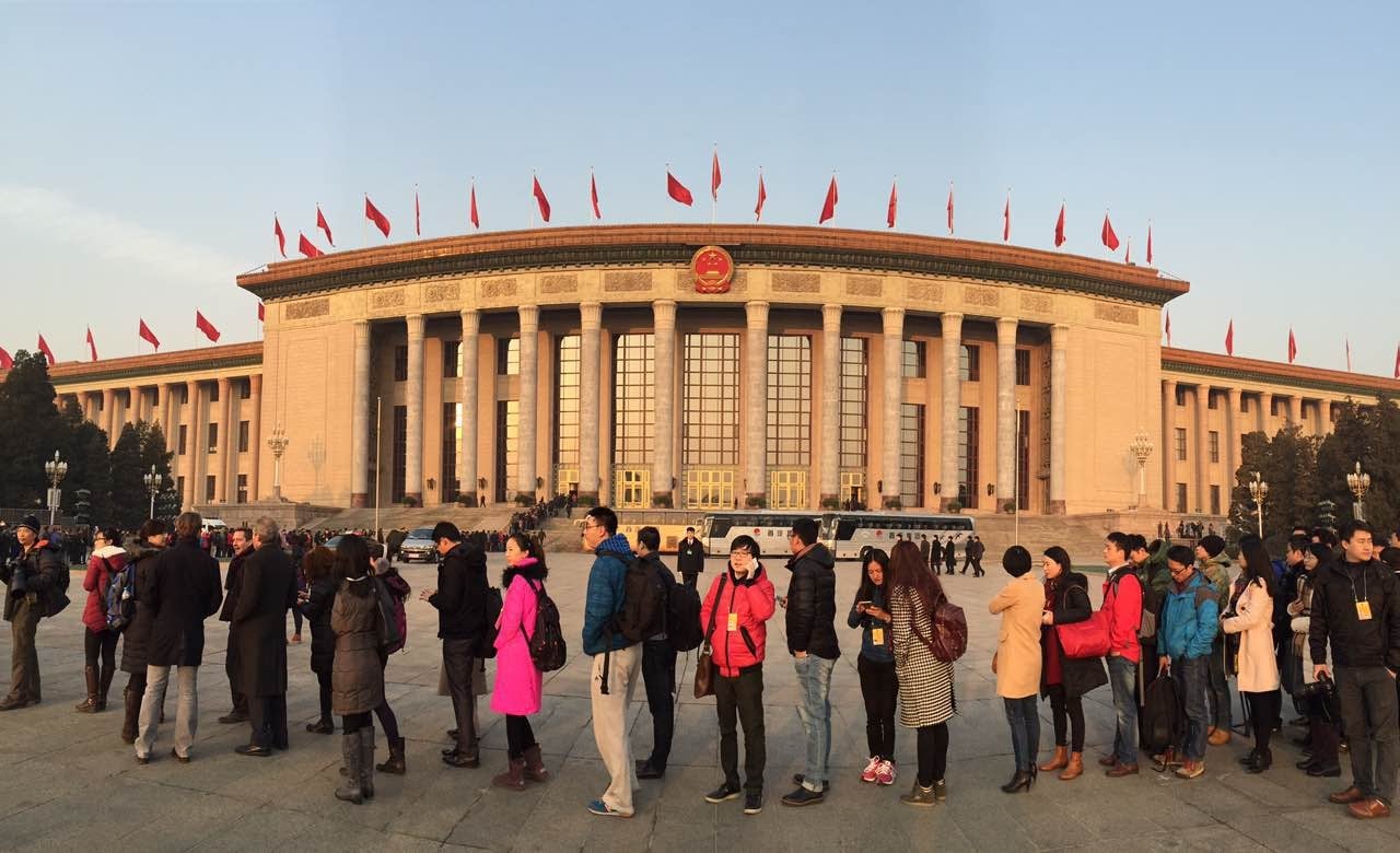 Journalists line up this morning outside the Great Hall of the People awaiting copies of Premier Li Kekiang's working report and the start of the annual National People's Congress meeting. Photo: Simon Song