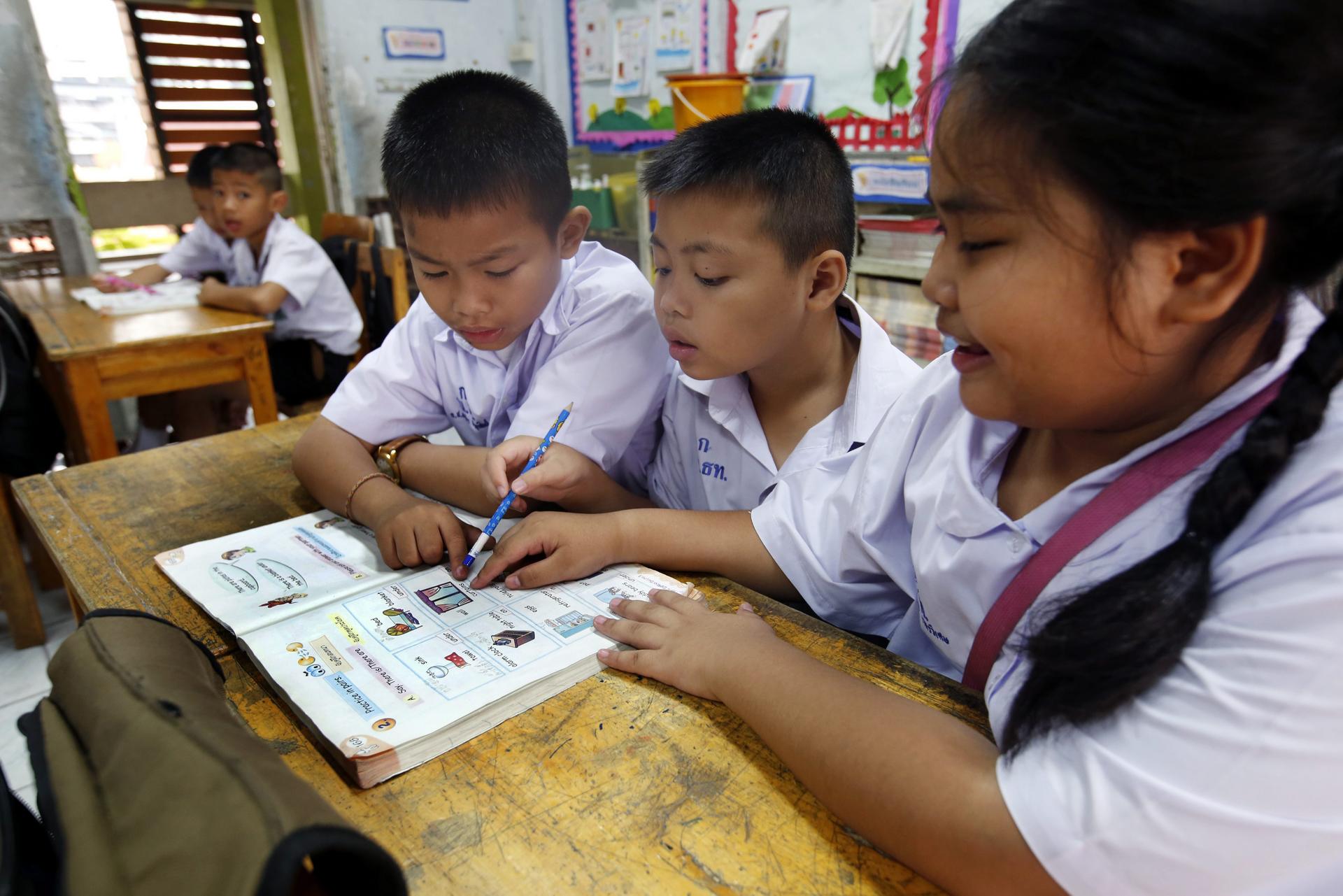 Students study English at a Bangkok primary school. Photo: EPA