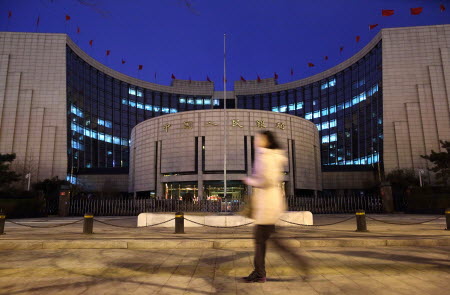 The People’s Bank of China intervened early in 2014 to squash the one-way bet on yuan appreciation. Photo: Bloomberg