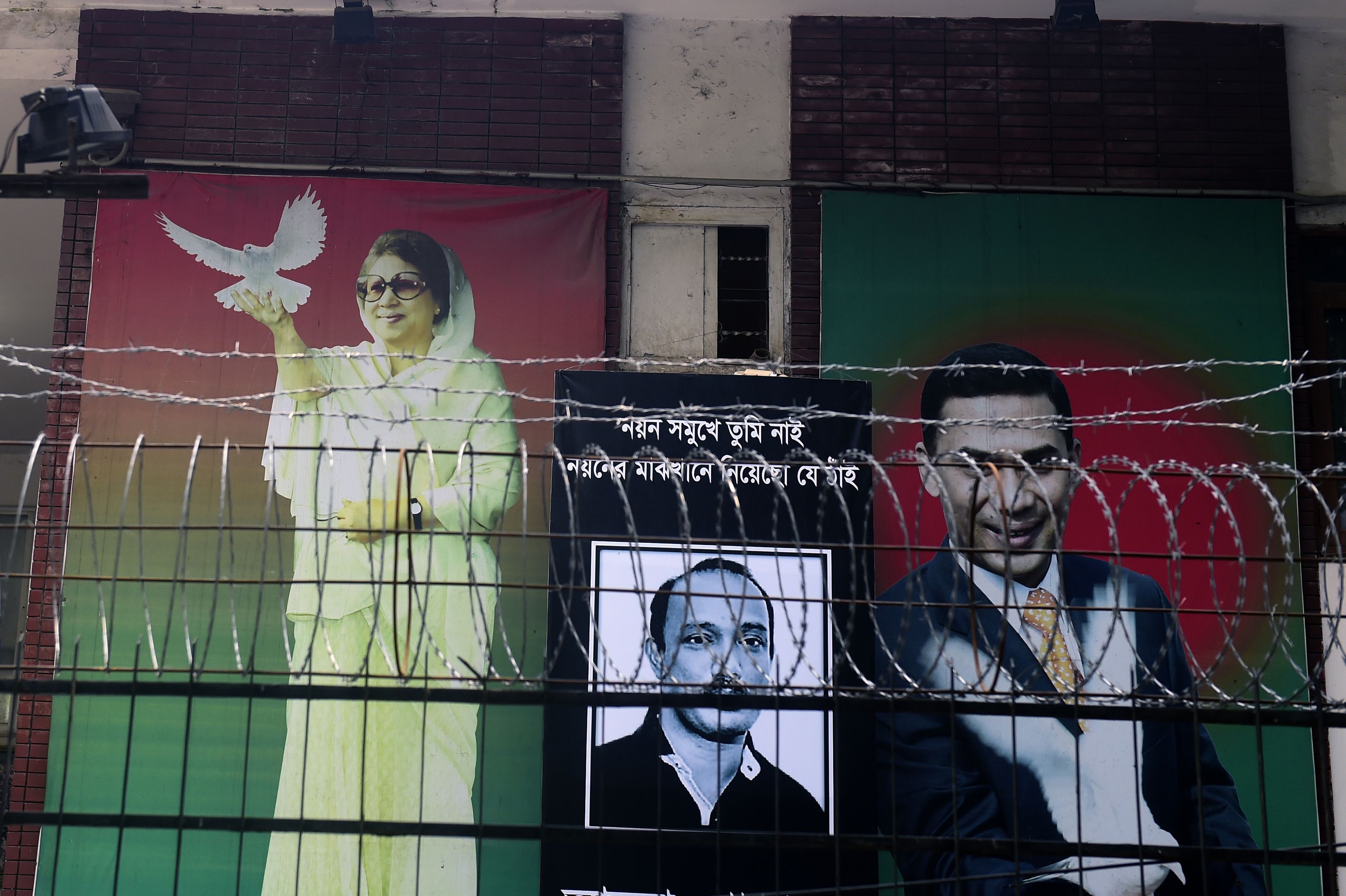 A poster of Khaleda Zia is seen, with those of her two sons, in front of the Bangladesh Nationalist Party office last month during a nationwide blockade. Photo: AFP