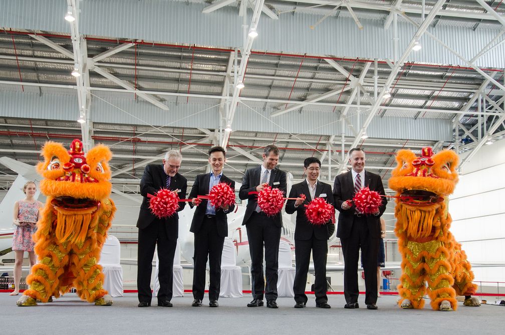 A ribbon-cutting ceremony at the grand opening of Jet Aviation Singapore in May last year included Robert Smith, president of Jet Aviation Group (right).