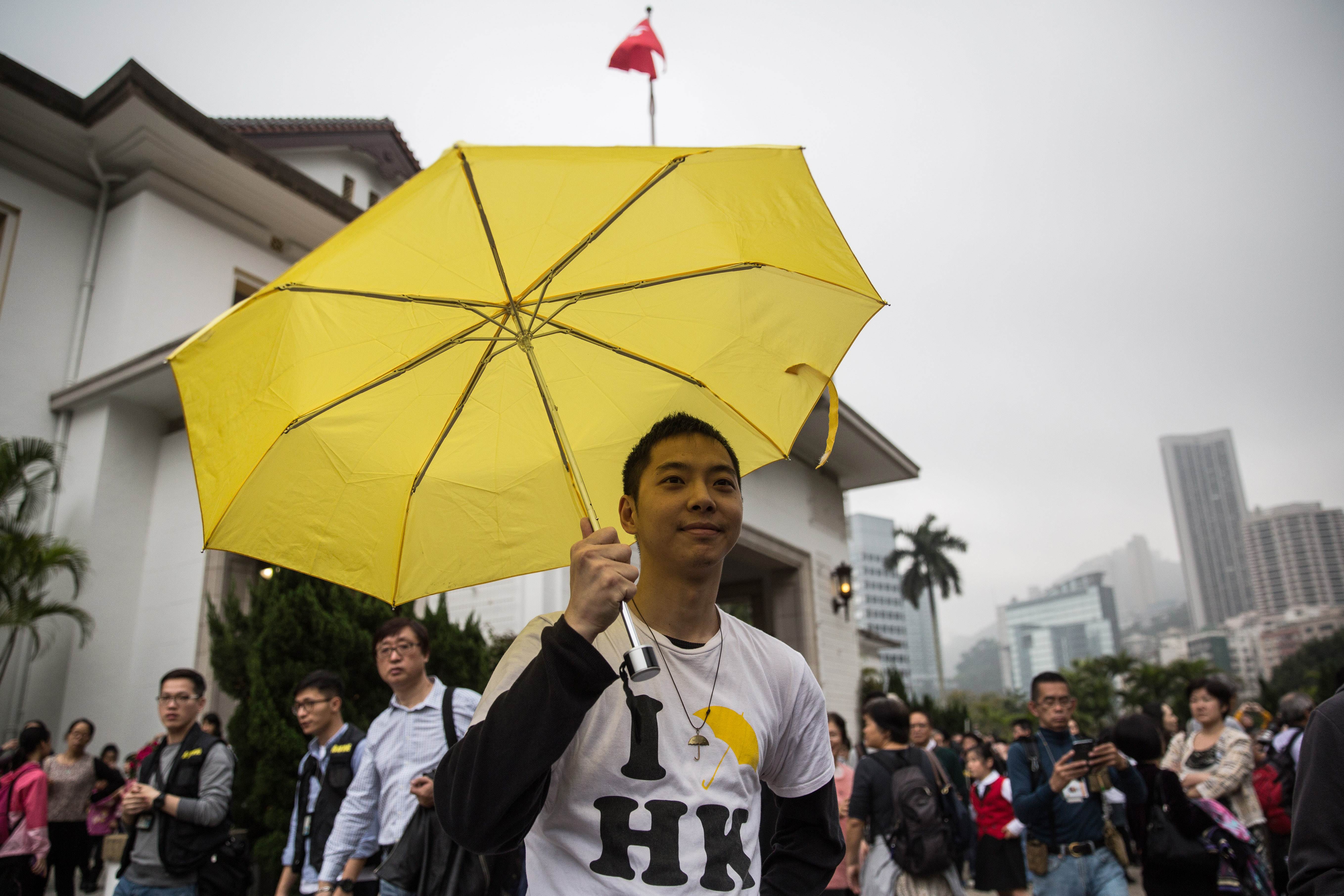 A pro-democracy protester makes a point at the annual open day for Government House over the weekend. Photo: AFP  
