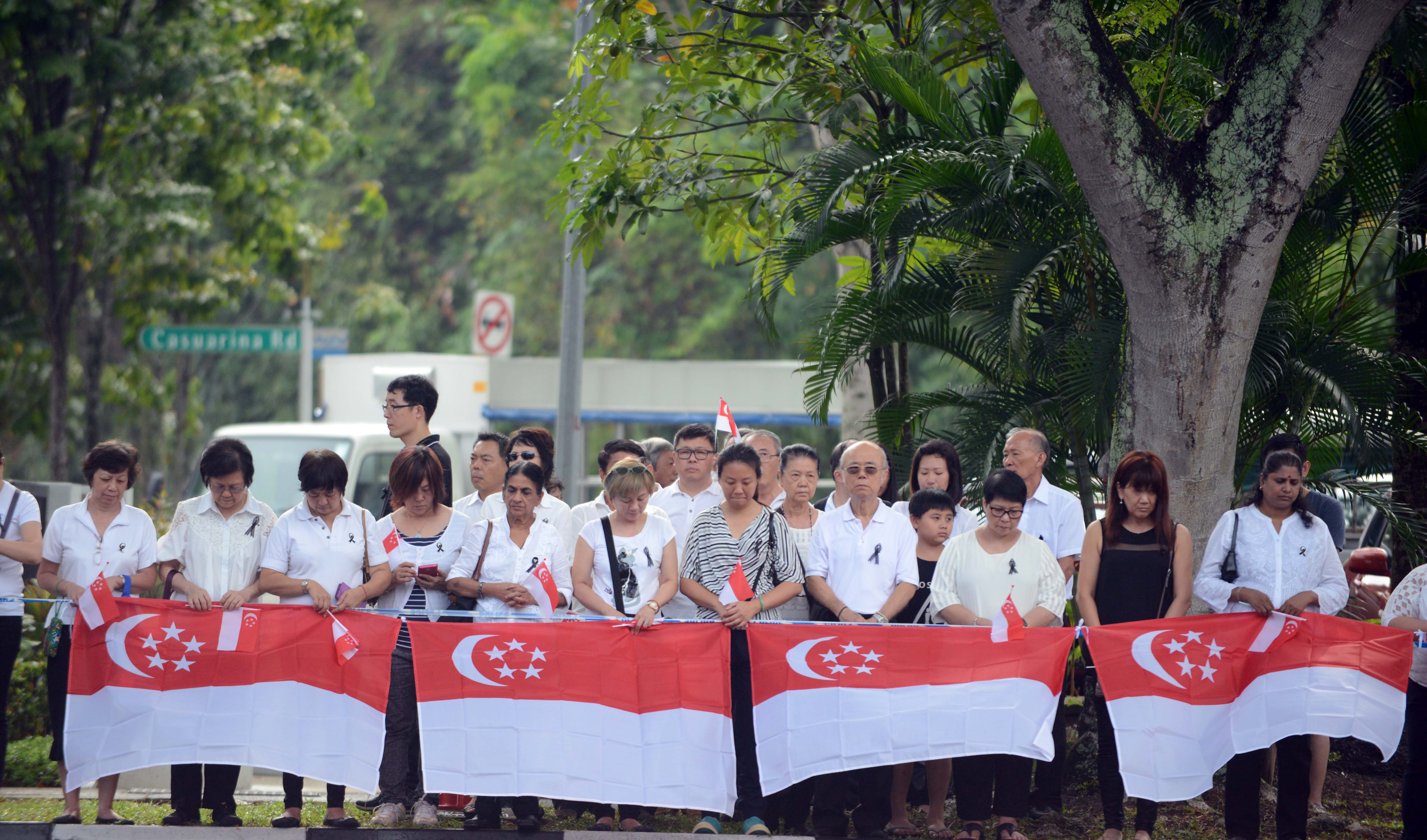 People in Singapore observe a minute's silence on Sunday to mourn the late Lee Kuan Yew. Through competitive elections, Singaporean voters have the power to decide if the PAP should stay in power. Photo: AFP
