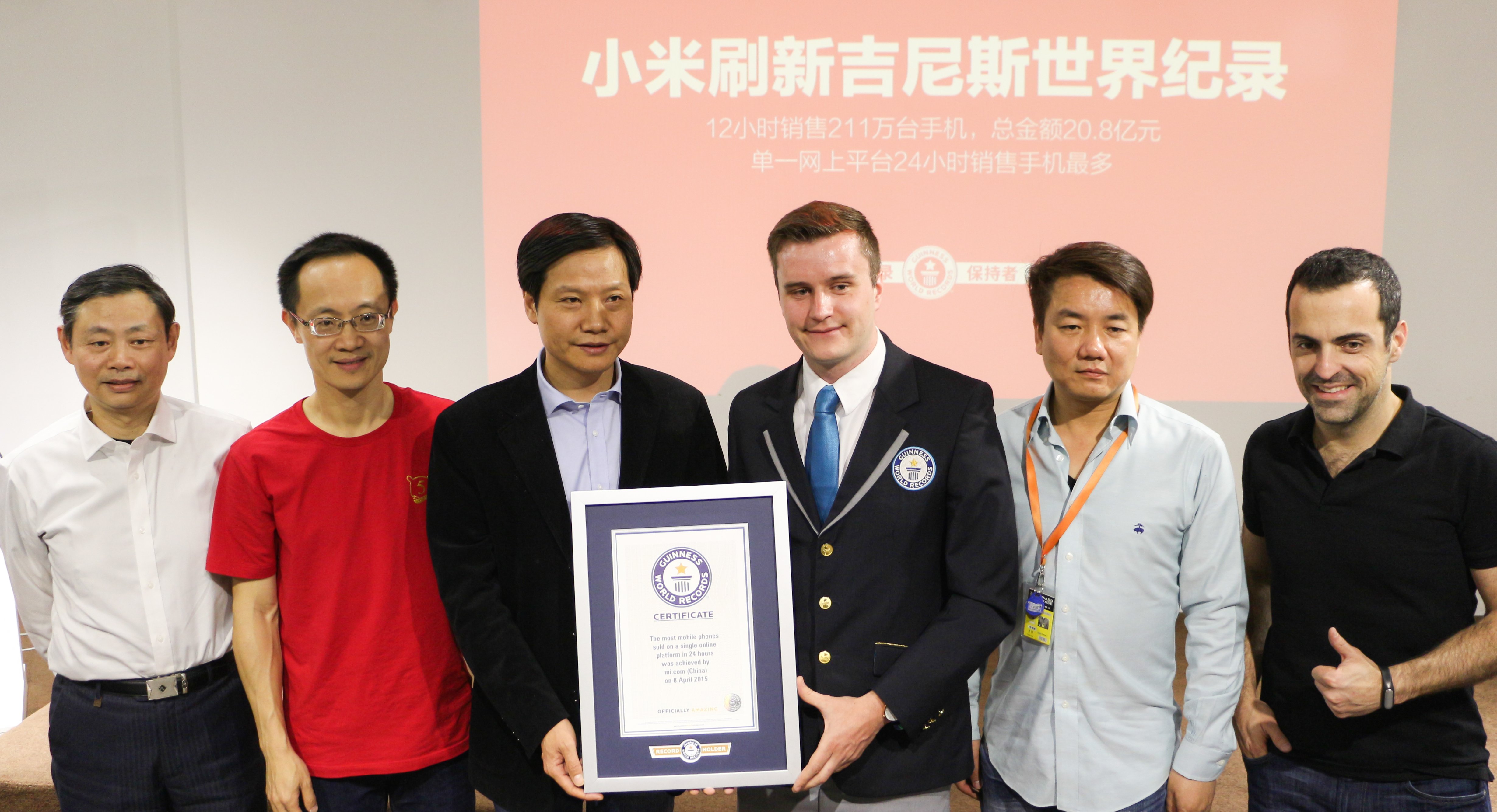 Xiaomi CEO Lei Jun and other senior staff pose with an official Guinness World Records certificate. Photo: SCMP Pictures