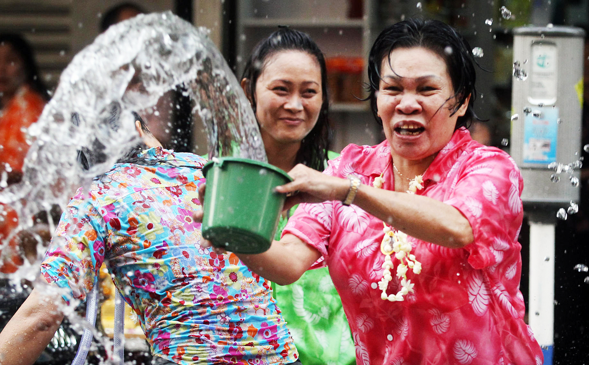 Revellers in Kowloon City douse a passer-by in water. Photo: K.Y. Cheng