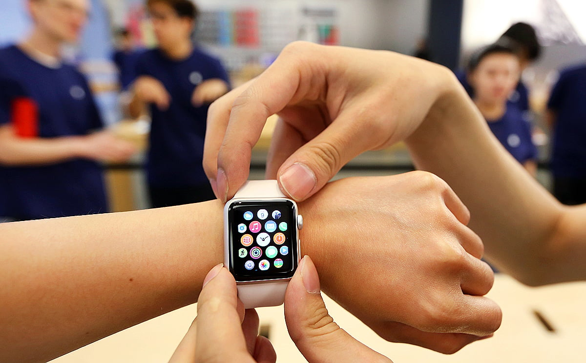 A customer tries on an Apple Watch at the Apple Store in Causeway Bay. Photo: Nora Tam