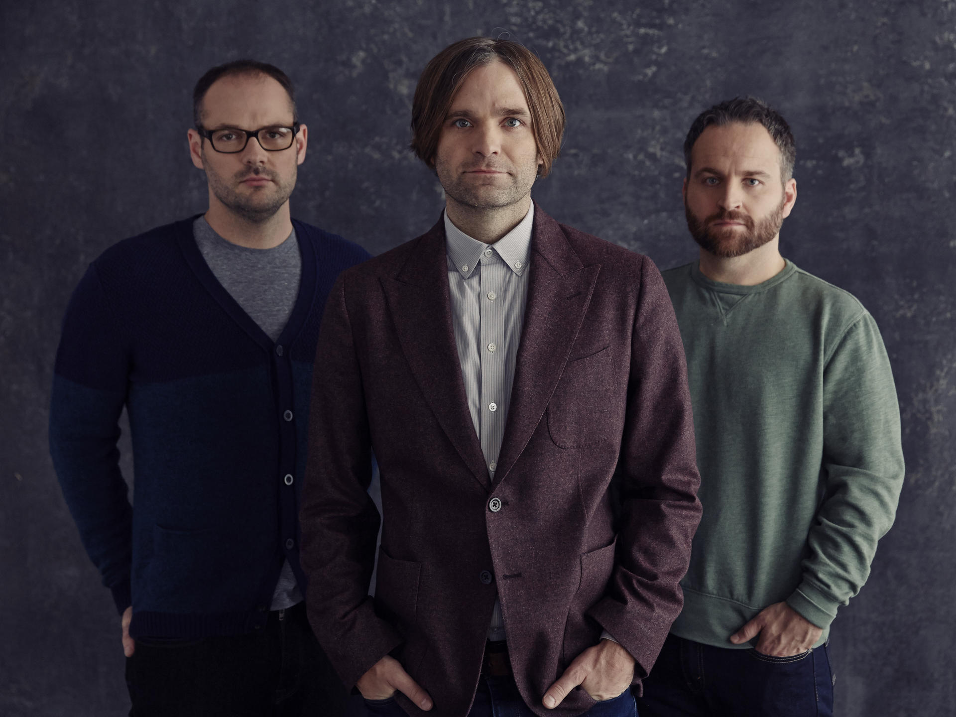 Ben Gibbard (centre) with current Death Cab for Cutie members Nick Harmer (left) and Jason McGerr.