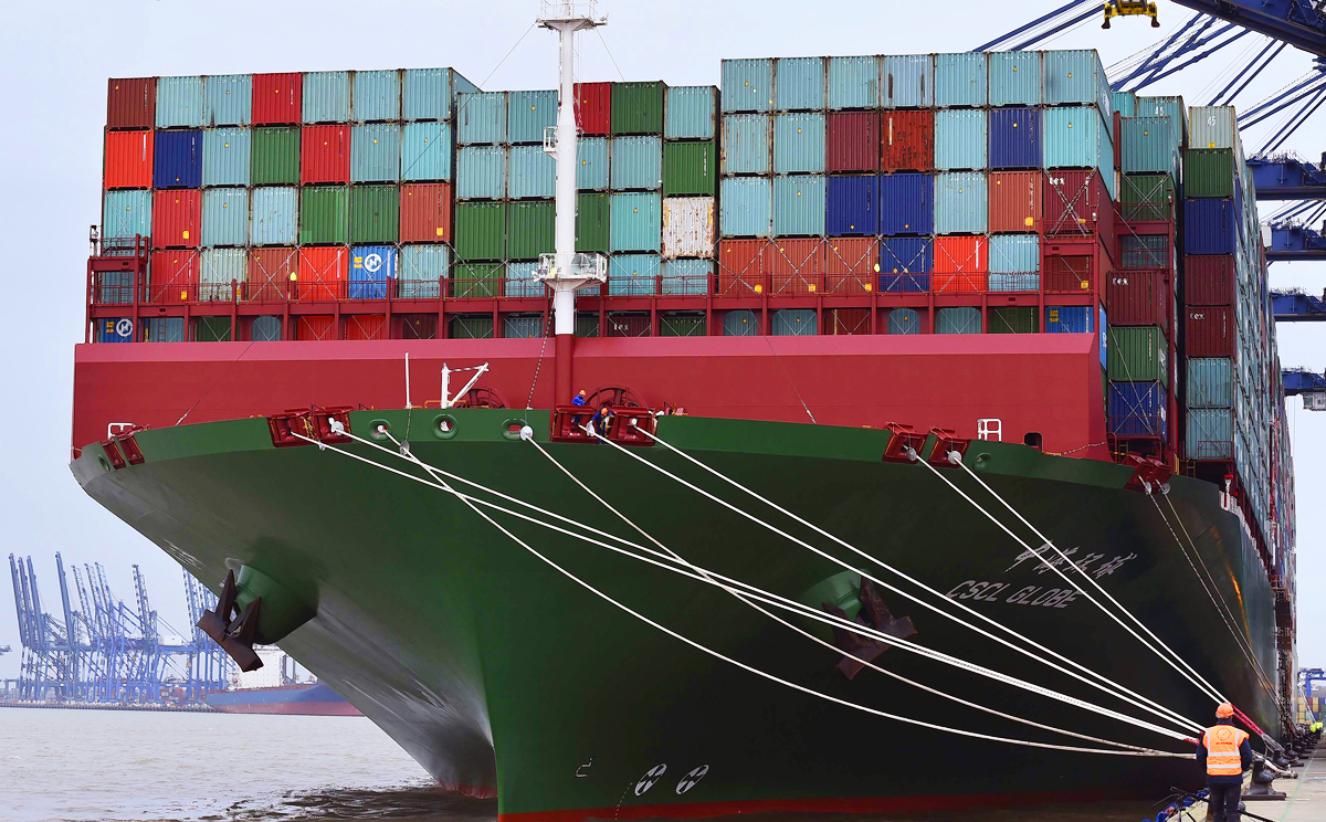 Onlookers watch as the largest container ship in world, CSCL Globe, docks during its maiden voyage, at the port of Felixstowe in south east England. Photo: Reuters