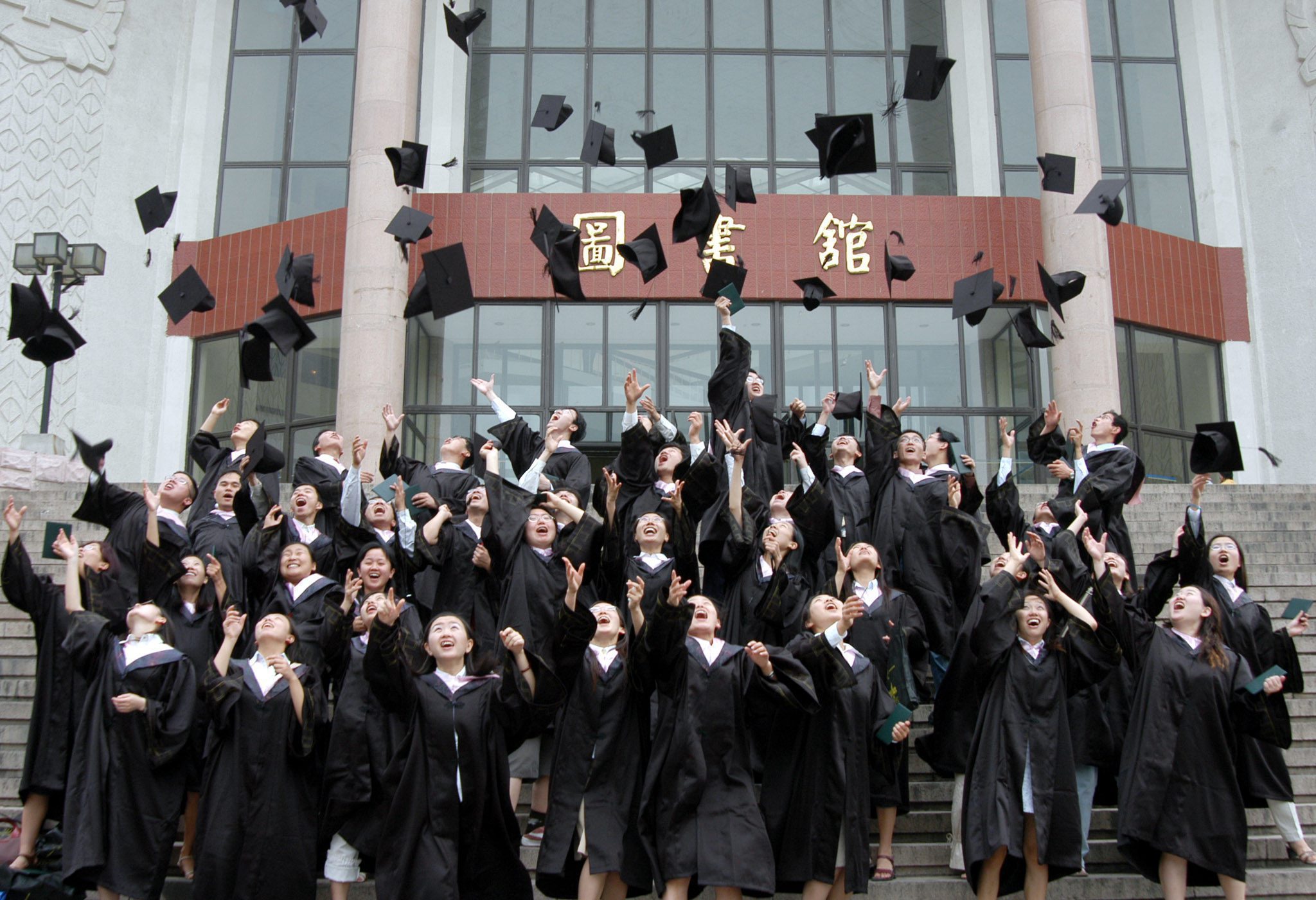 Students graduating from Peking University, one of the country's top centres of higher education. Most students who took part in the poll said they relied on their families to fund their studies. Photo: EPA