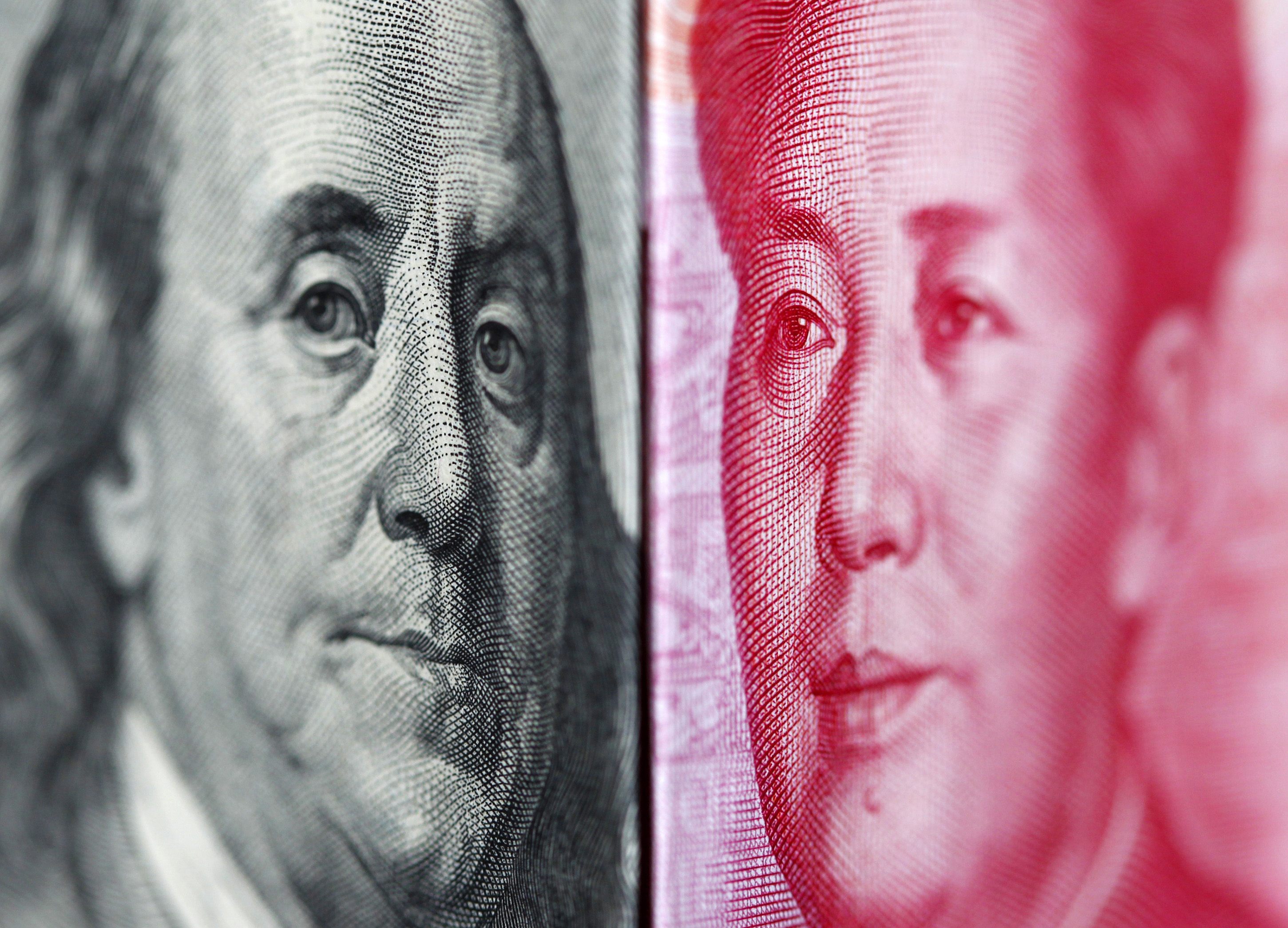 The US dollar and the Chinese yuan side-by-side. The yuan is again the world's fifth biggest payment currency, according to a monthly report by Swift. Photo: Reuters