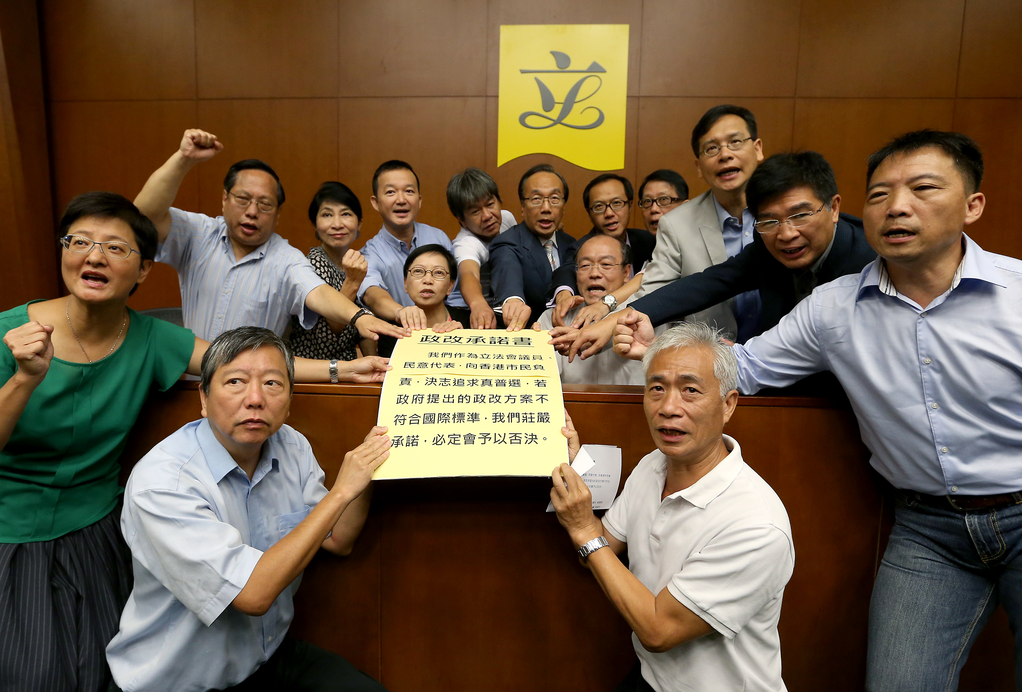 Some of the 26 pan-democrat legislators who signed a declaration vowing to veto the government proposal. Photo: K. Y. Cheng 