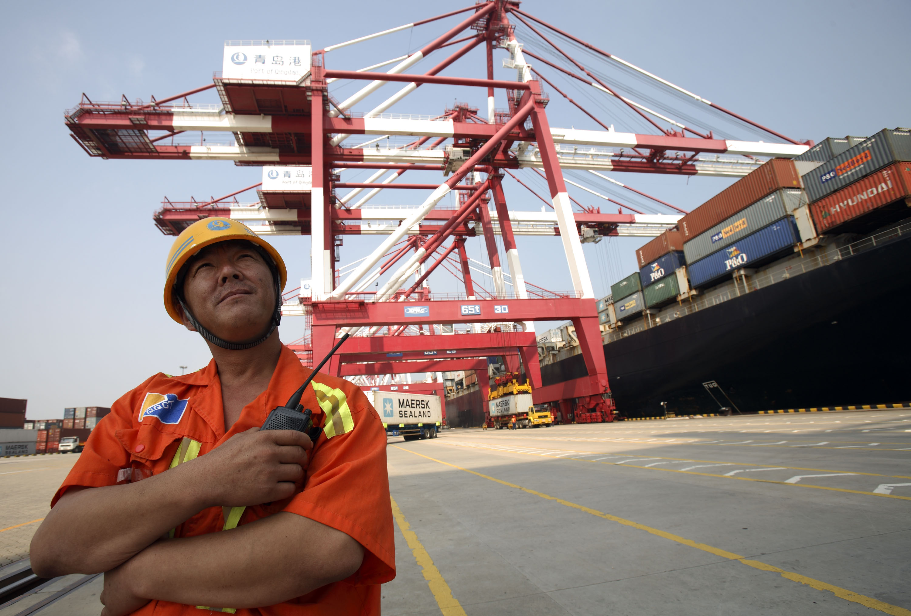 Containers are loaded in China's Qingdao port. The country's weak March trade surplus is likely an aberration in a long-term trend. Photo: Bloomberg 