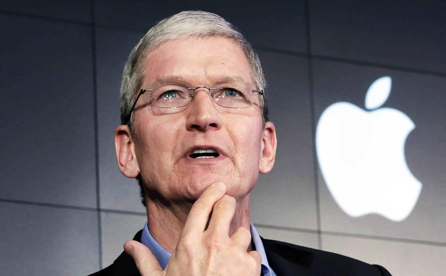 Apple CEO Tim Cook responds to a question during a news conference. Photo: Reuters