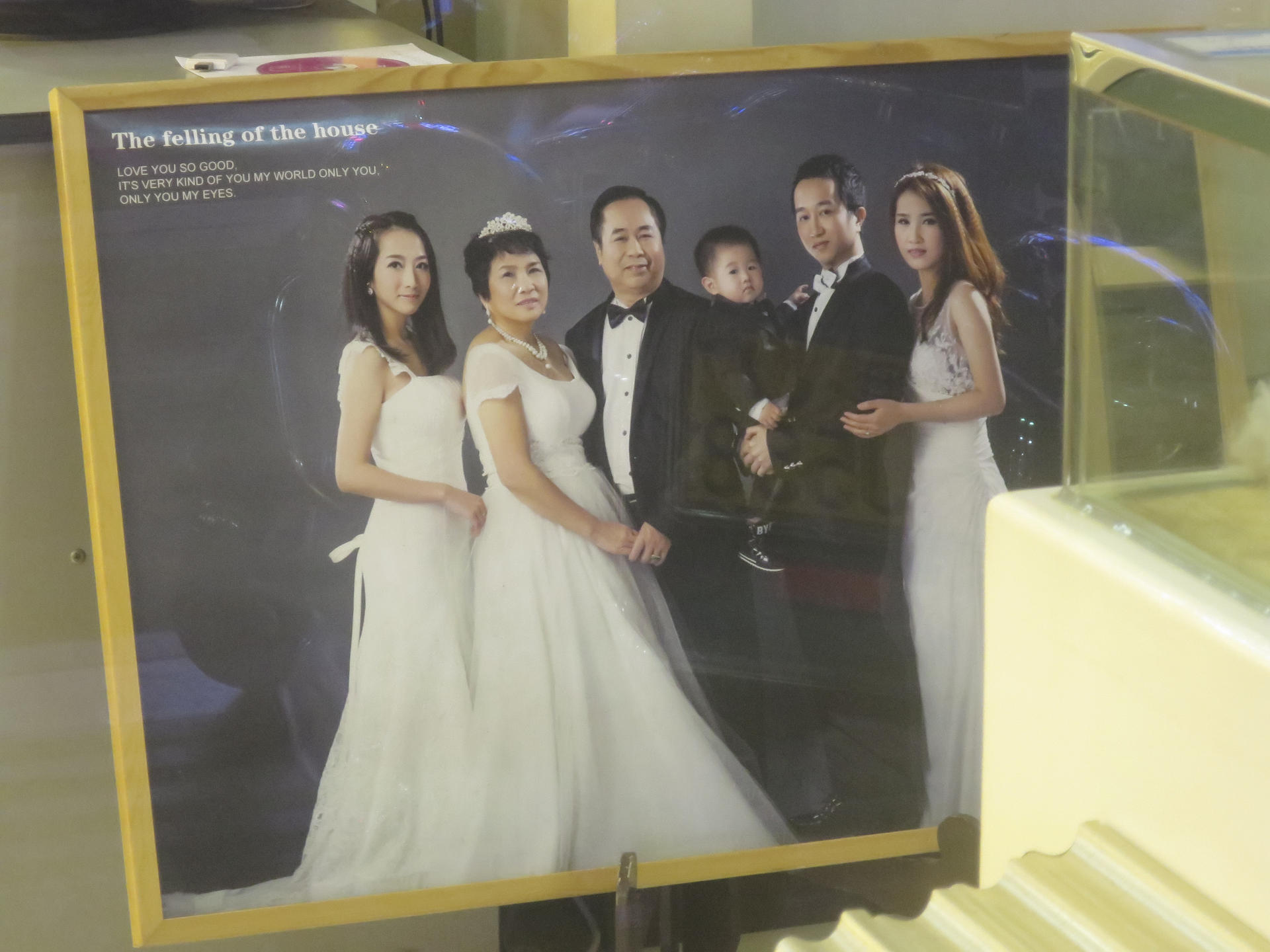 A family wedding photo in a studio in Guangdong. Why are the happy couple middle-aged and who are the people on either side, the writer wonders. Photo: Cecilie Gamst Berg