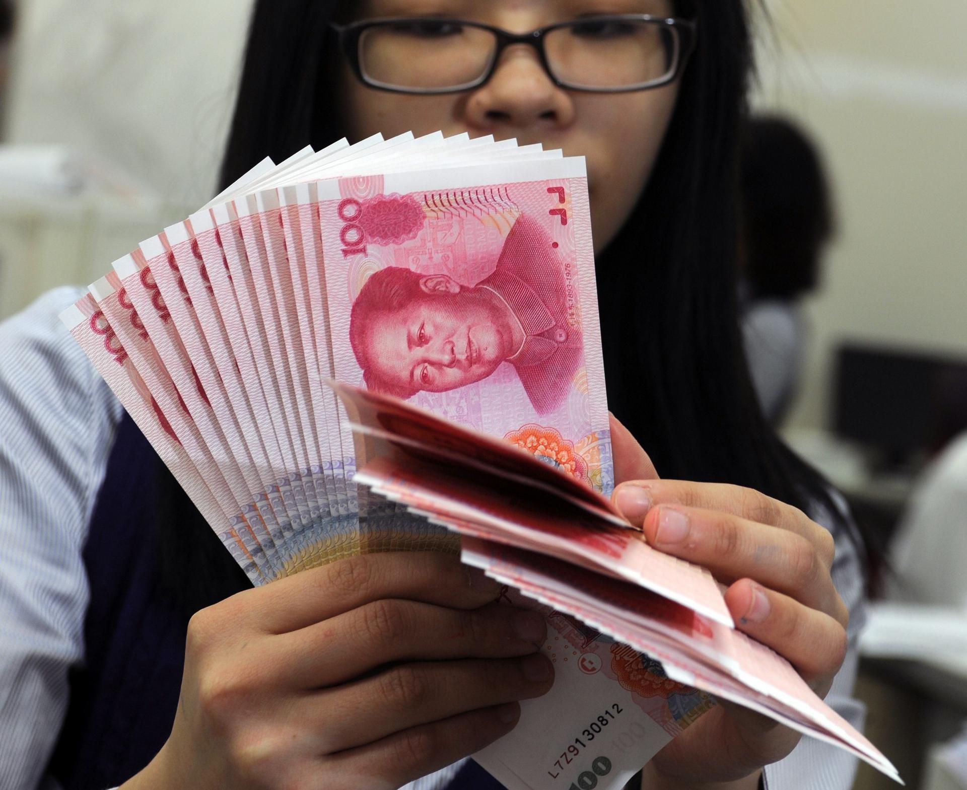 Offshore yuan bonds worth 12 billion yuan were offered yesterday, including 5 billion yuan of three-year bonds at 2.8 per cent. Photo: AFP