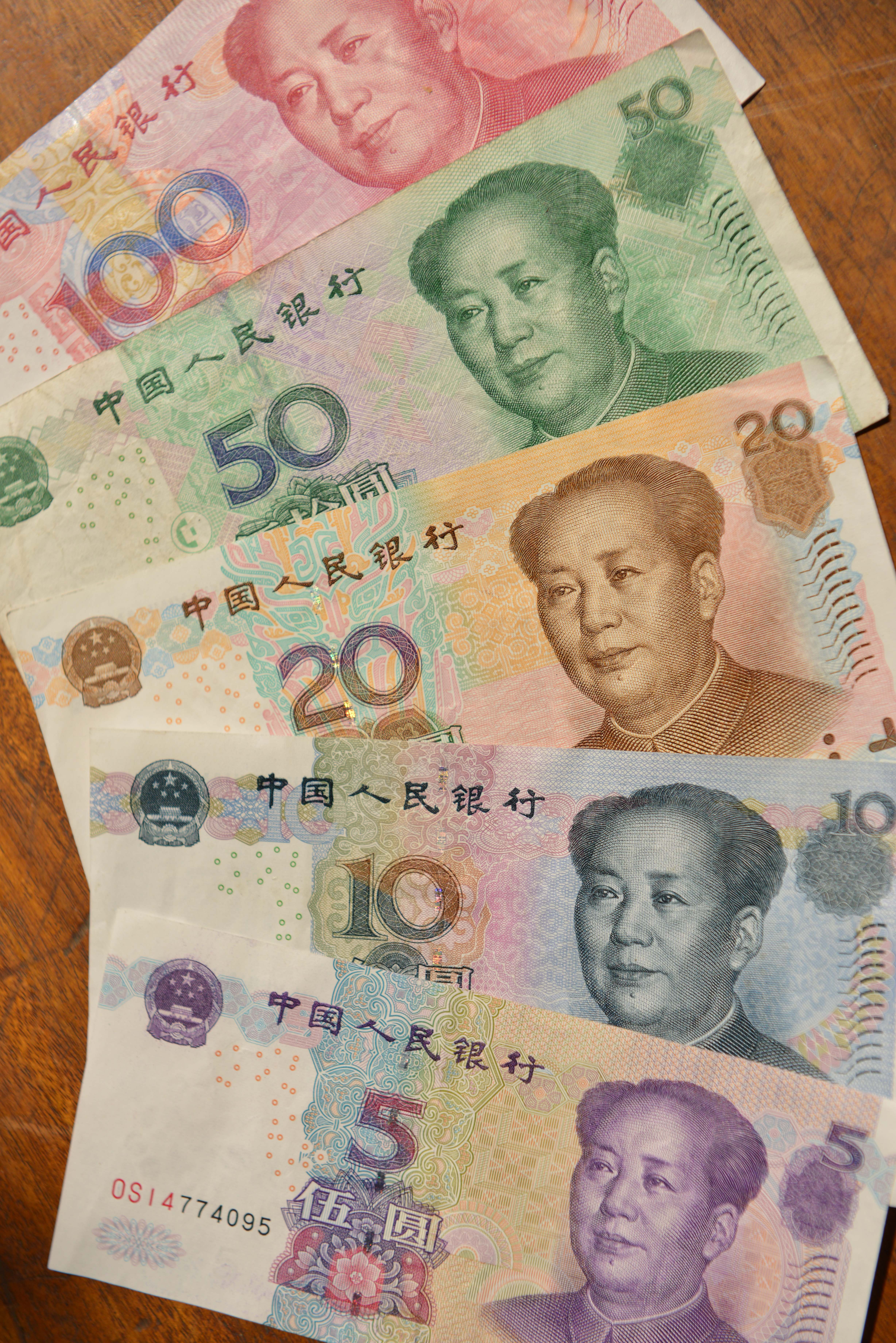 A lineup of different yuan bank notes as China's central bank set the midpoint of the currency at its weakest level in a month on Wednesday. Photo: AFP