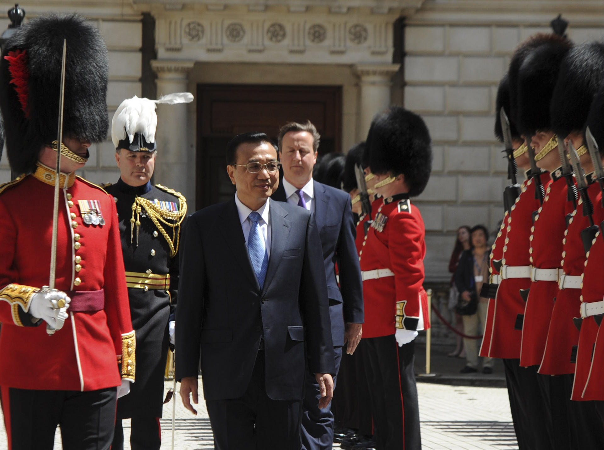 Li Keqiang is greeted to London by David Cameron a year ago.