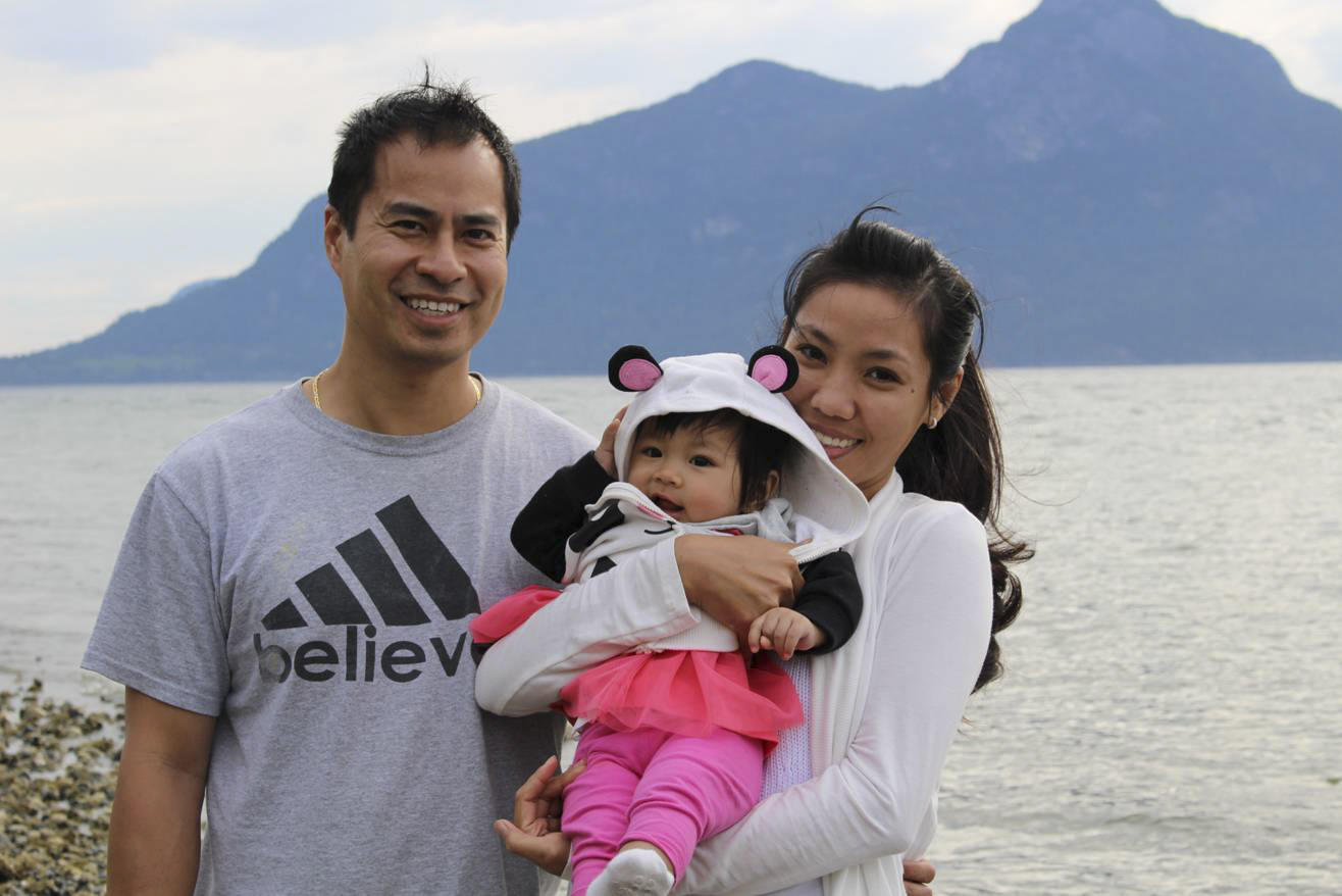 Harry Yung with his wife, Thu, and their baby, Jessica, in Vancouver. Photo: Petti Fong