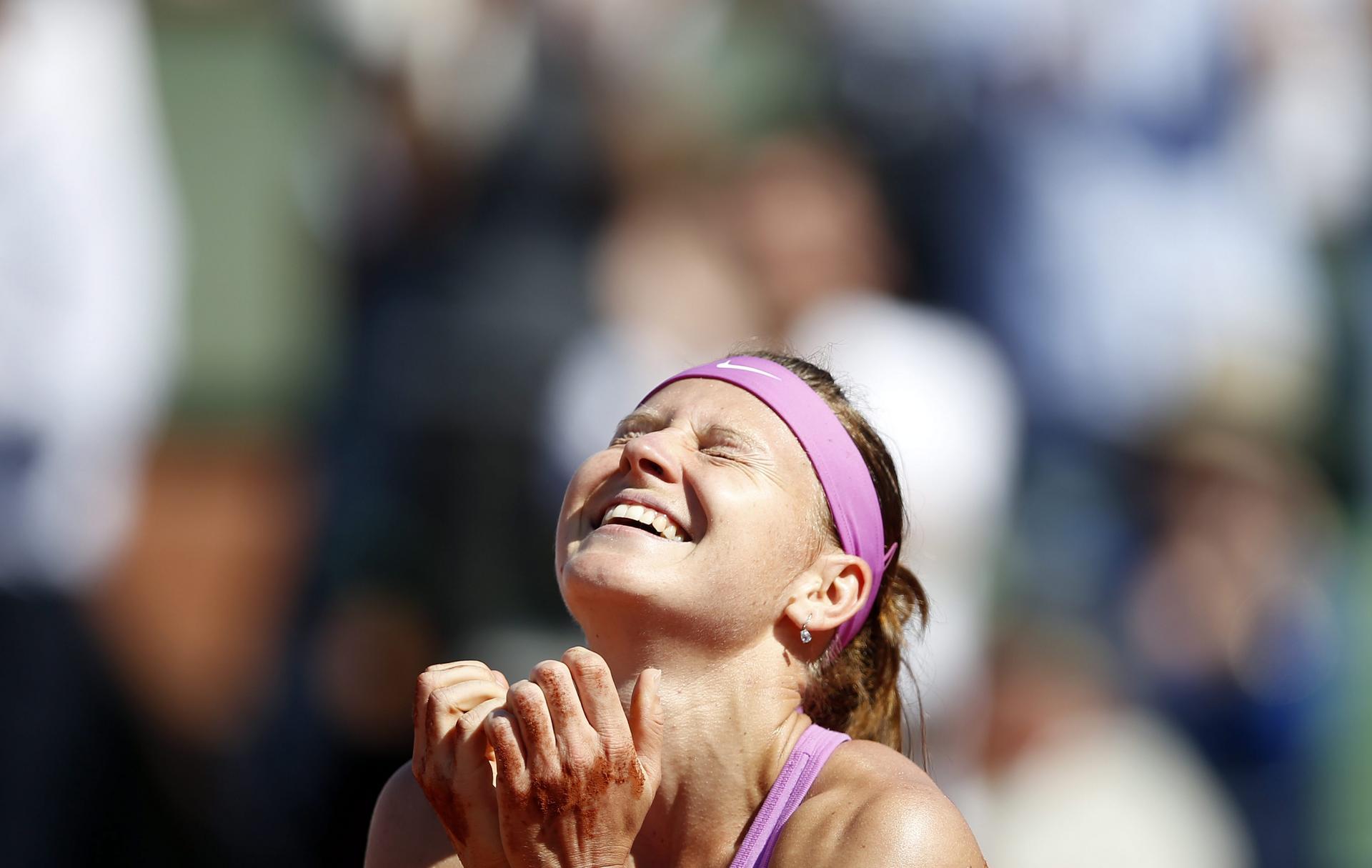 A jubilant Lucie Safarova reacts after winning her semi-final against Ana Ivanovic of Serbia 7-6, 7-5. Photos: EPA