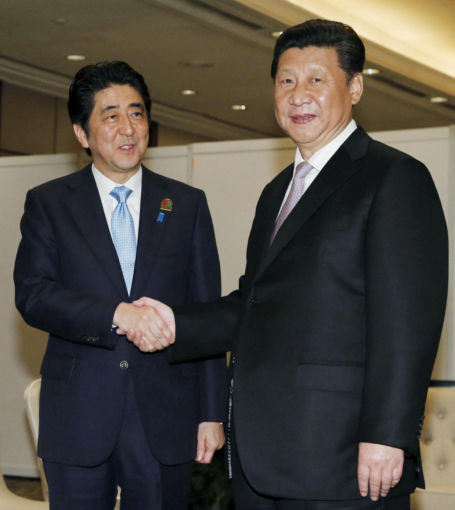 Prime Minister Shinzo Abe (left) with President Xi Jinping earlier this year.Intimate Rivals examines the effect China's rise has on Japan. Photo: Reuters