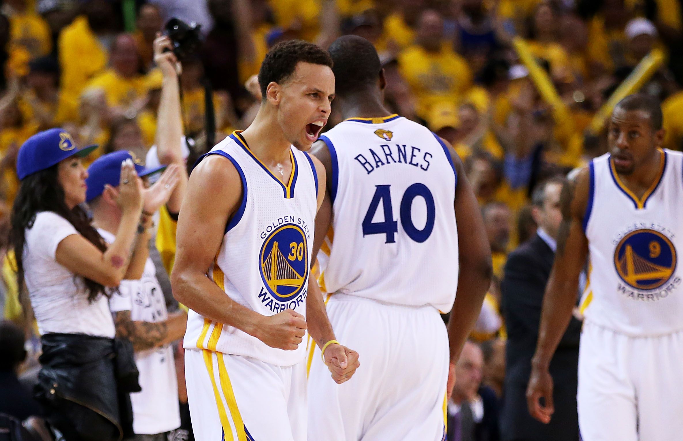 Stephen Curry urges on his teammates with the game in extra time. Photo: AFP