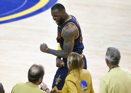 LeBron James pumps his fist in celebration after Cleveland Cavaliers win game two of the NBA Finals against Golden State Warriors. Photos: USA Today Sports