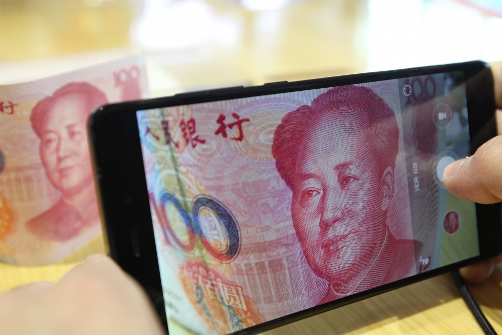 A 100-yuan note bearing the picture of Mao Zedong is seen. The yuan is now the world's 5th biggest payment currency. Photo: Simon Song/SCMP