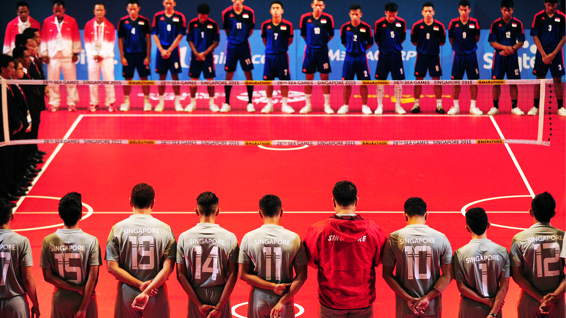 Players and officials observe a minute of silence in respect to the victims of an earthquake which struck Malaysia's Mount Kinabalu at the SEA Games. Photo: AFP