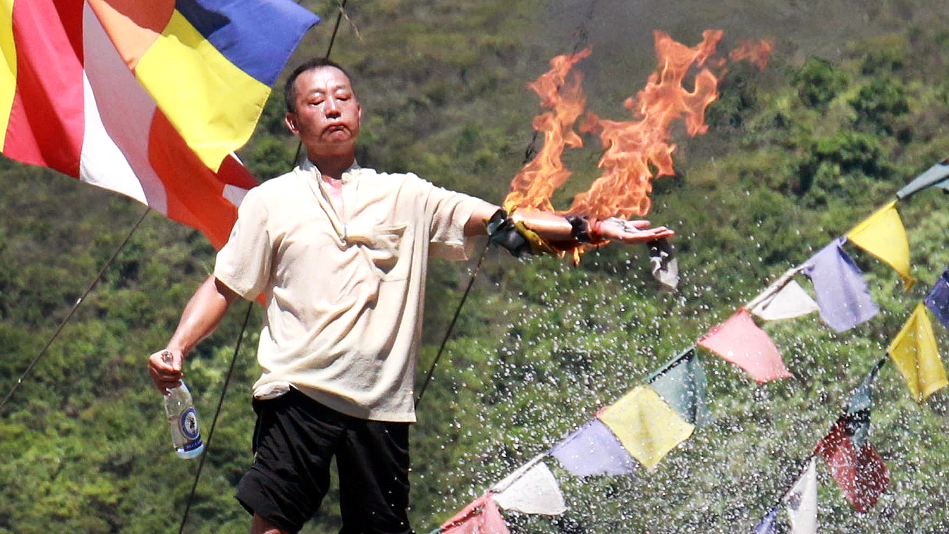Lau Kin-kwok, chief of the Po Yin Fat Yuen monastery, set his left arm on fire. Photo: SCMP Pictures
