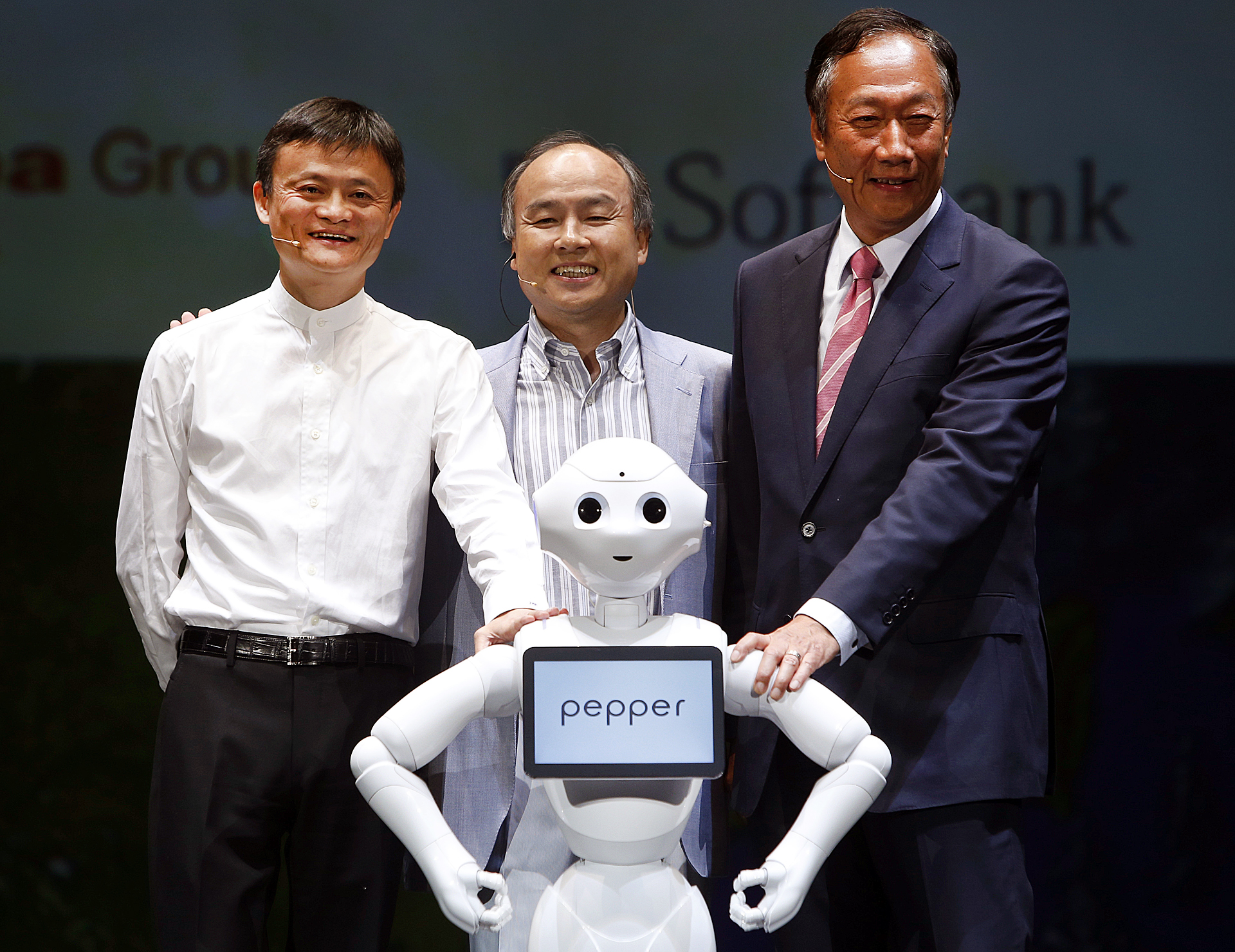 The three partners have the clout to make SoftBank's humanoid robot Pepper a global player. Built by Foxconn, it is due to go on sale in Japan this weekend with an expected retail price of around US$1,600. Photo: Xinhua 