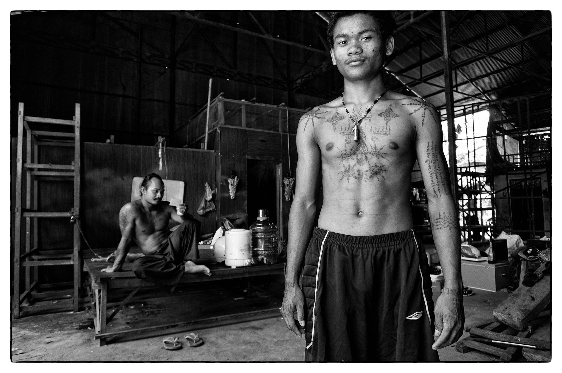 A student of tattoo master Teven Say (left) displays his ink in his mentor's studio in Siem Reap, Cambodia. Photos: Nathan Thompson; Emily Townsend