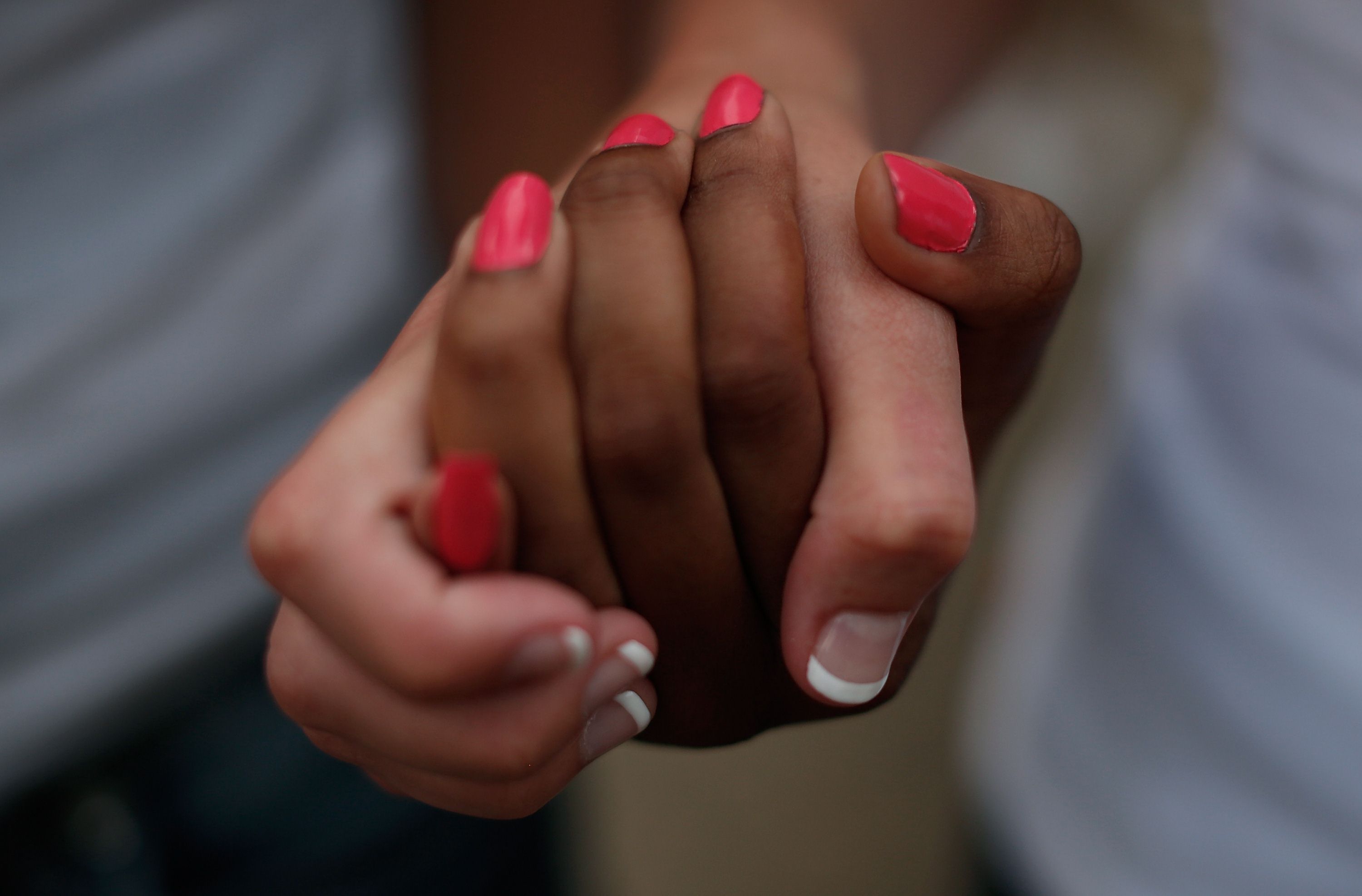 Students from the University of South Carolina and South Carolina State University link hands during a moment of silence for the victims of the church killings. Photo: AFP