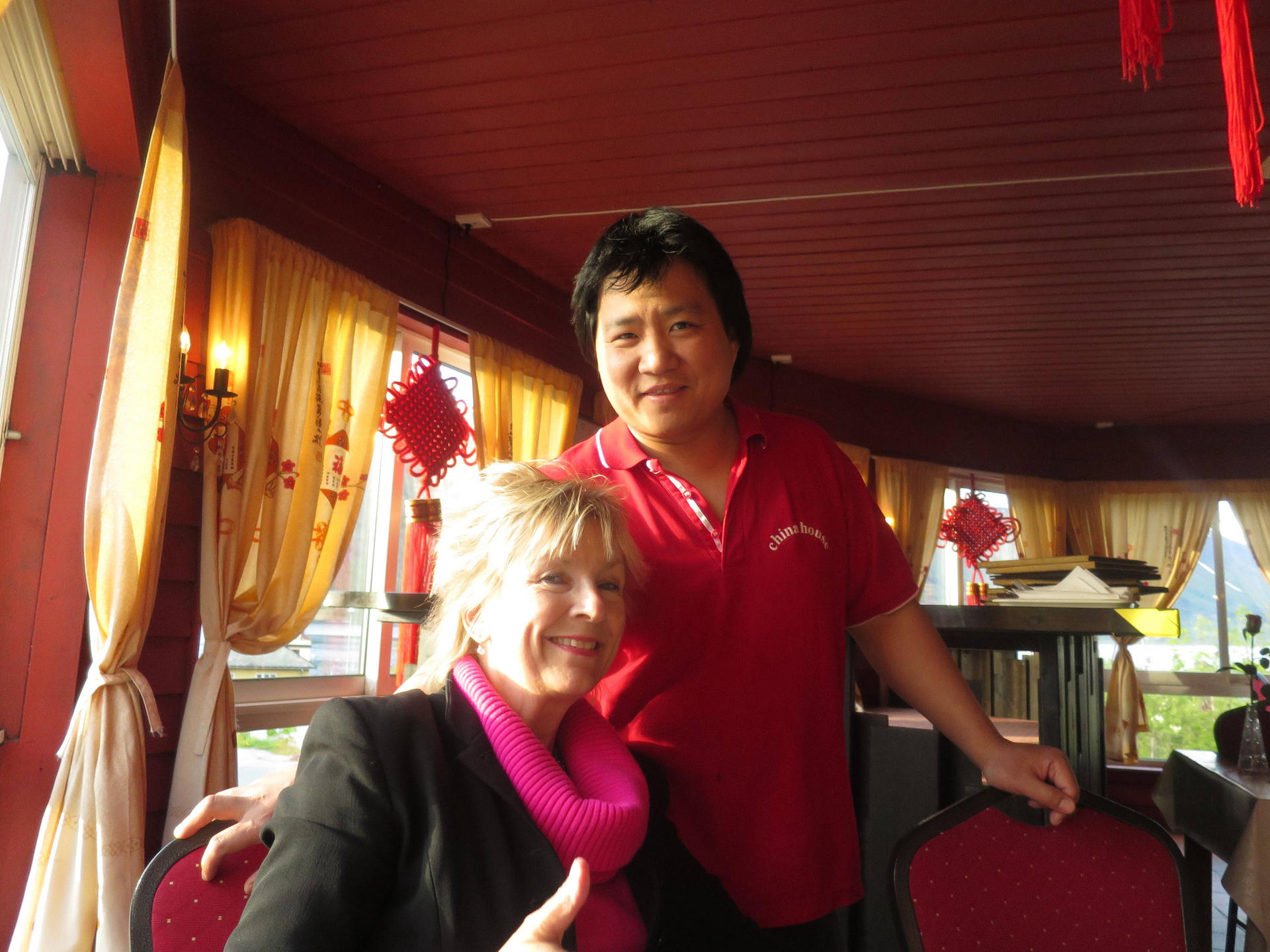 Cecilie Gamst Berg with the waiter at China House, Andalsnes, in Norway.