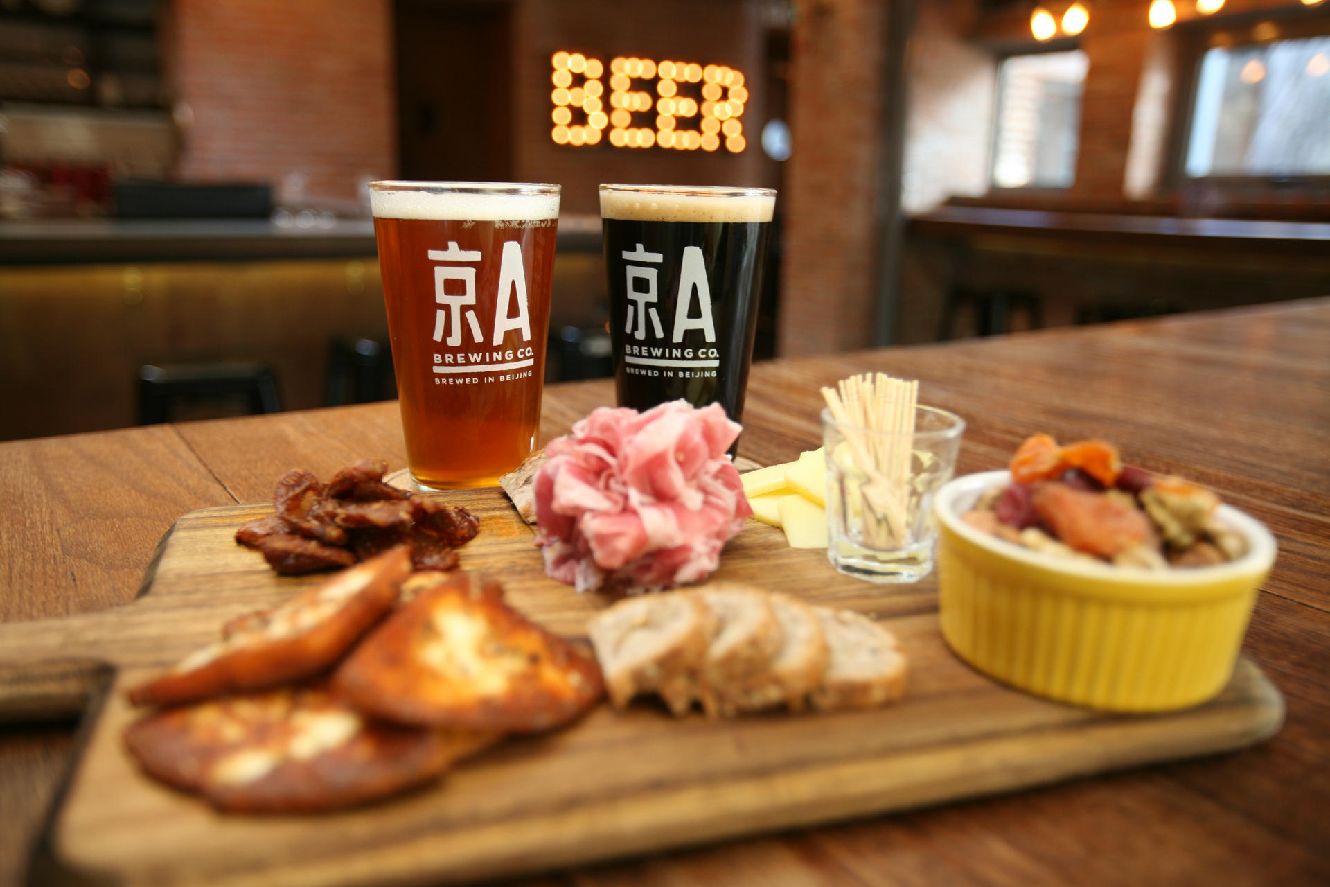 Craft beer and snack platter at Jing-A Taproom in Beijing.
