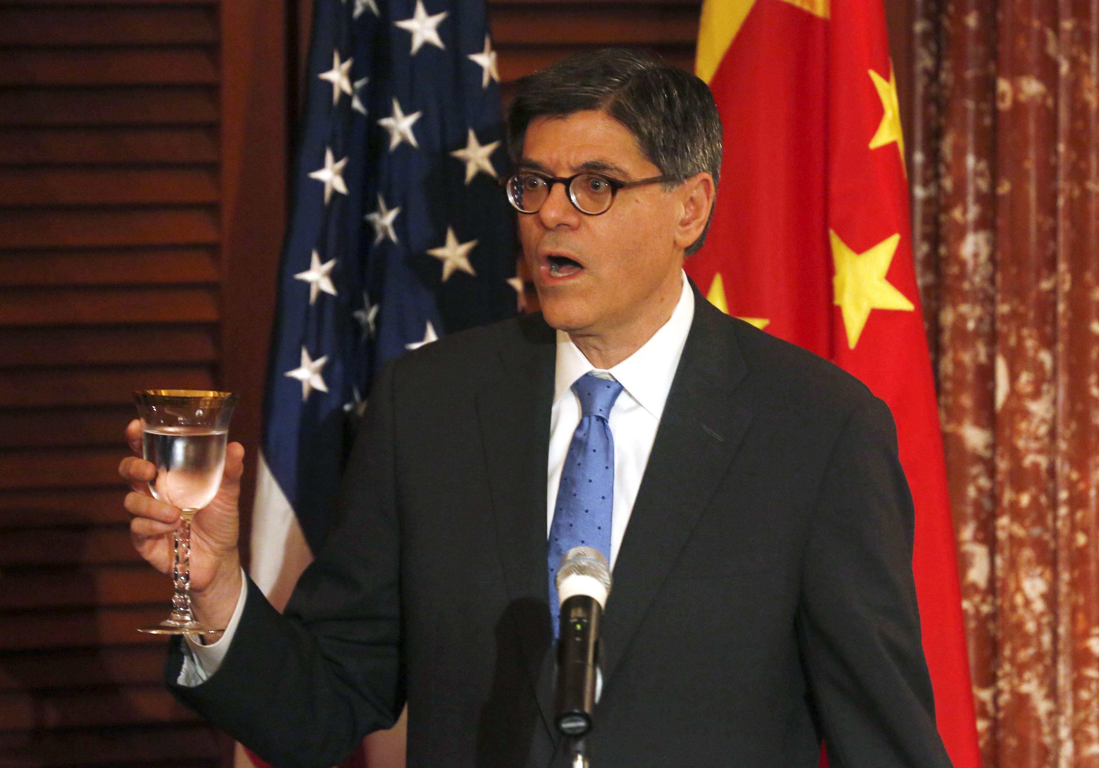 US Treasury Secretary Jack Lew gives a toast during bilateral talks with China as he urged Beijing to move to a market-determined currency policy. Photo: Reuters