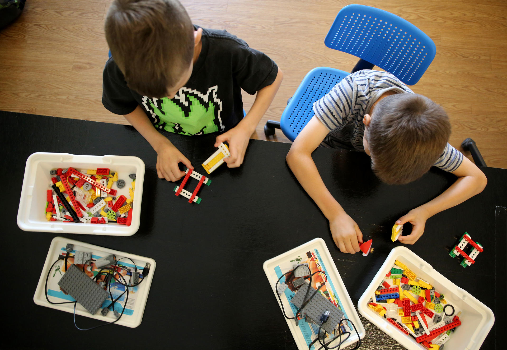 William Lerner, left, and William Kaegi learn coding skills while playing with blocks during a sports/coding summer camp in the US state of Illinois. Photo: Antonio Perez