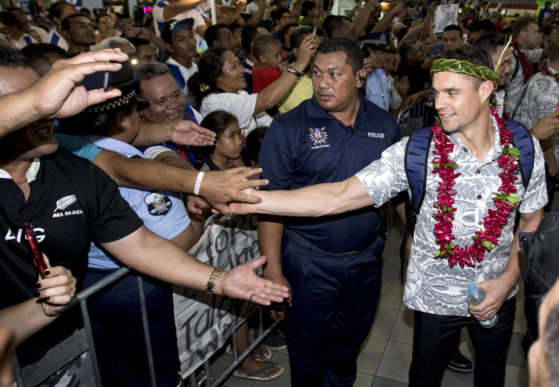 Dan Carter is welcomed by supporters as the All Blacks arrive in Apia. Photo: AP