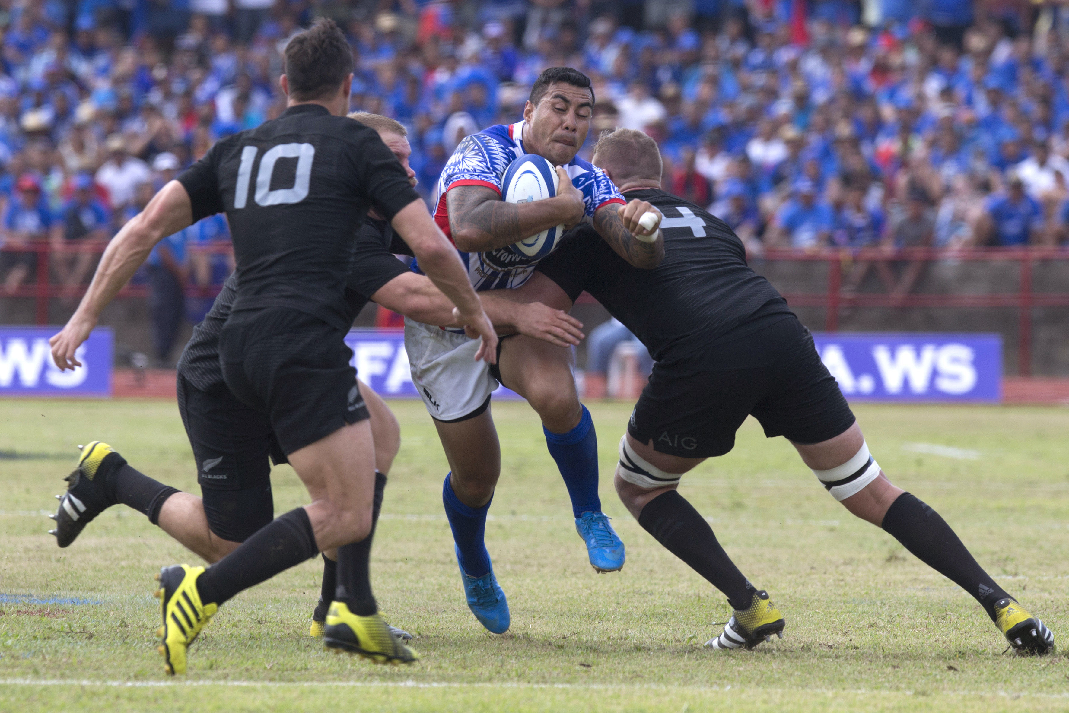 Samoa's Tusiata Pisi tries to break through the All Blacks line. Photos: AP