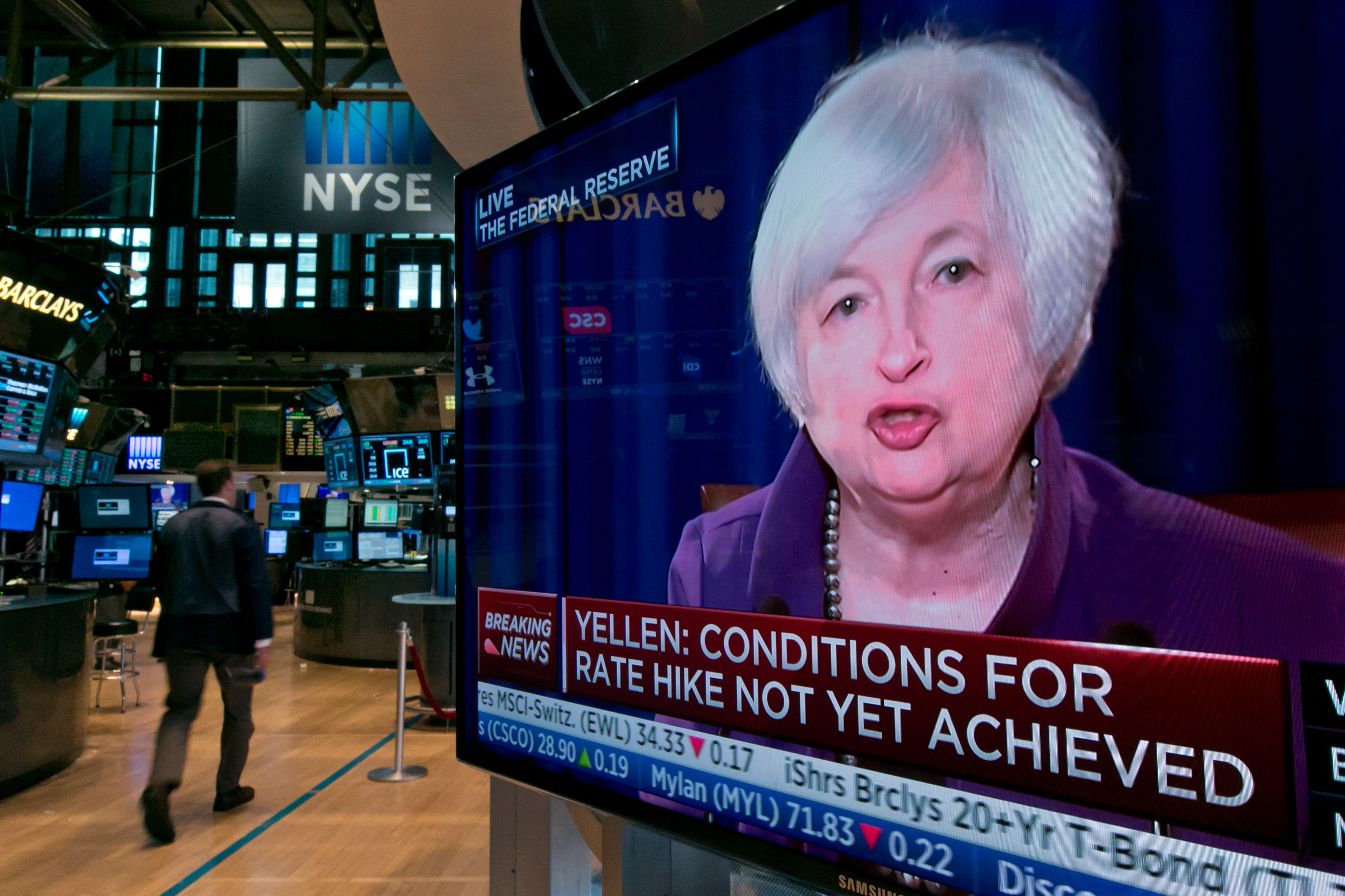 Traders in New York monitor a screen showing US Federal Reserve chairman Janet Yellen which will determine this year an interest rate rise. Photo: AP