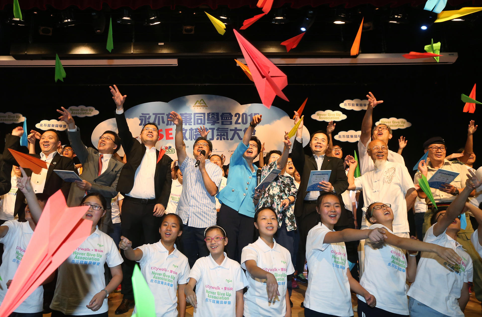 Chief Secretary Carrie lam Cheng Yuet-ngor (Second Row, from Left Fifth) takes the lead in reading out slogans with the students during Never Give Up Association 2015: DSE Cheer Up Party at the Hong Kong Baptist University in Kowloon Tong. Photo: David Wong