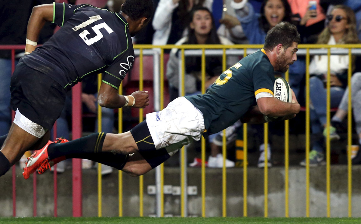South Africa's Willie le Roux scores a try under pressure from the World XV's Delon Armitage in Cape Town, South Africa on Saturday. Photo: Reuters