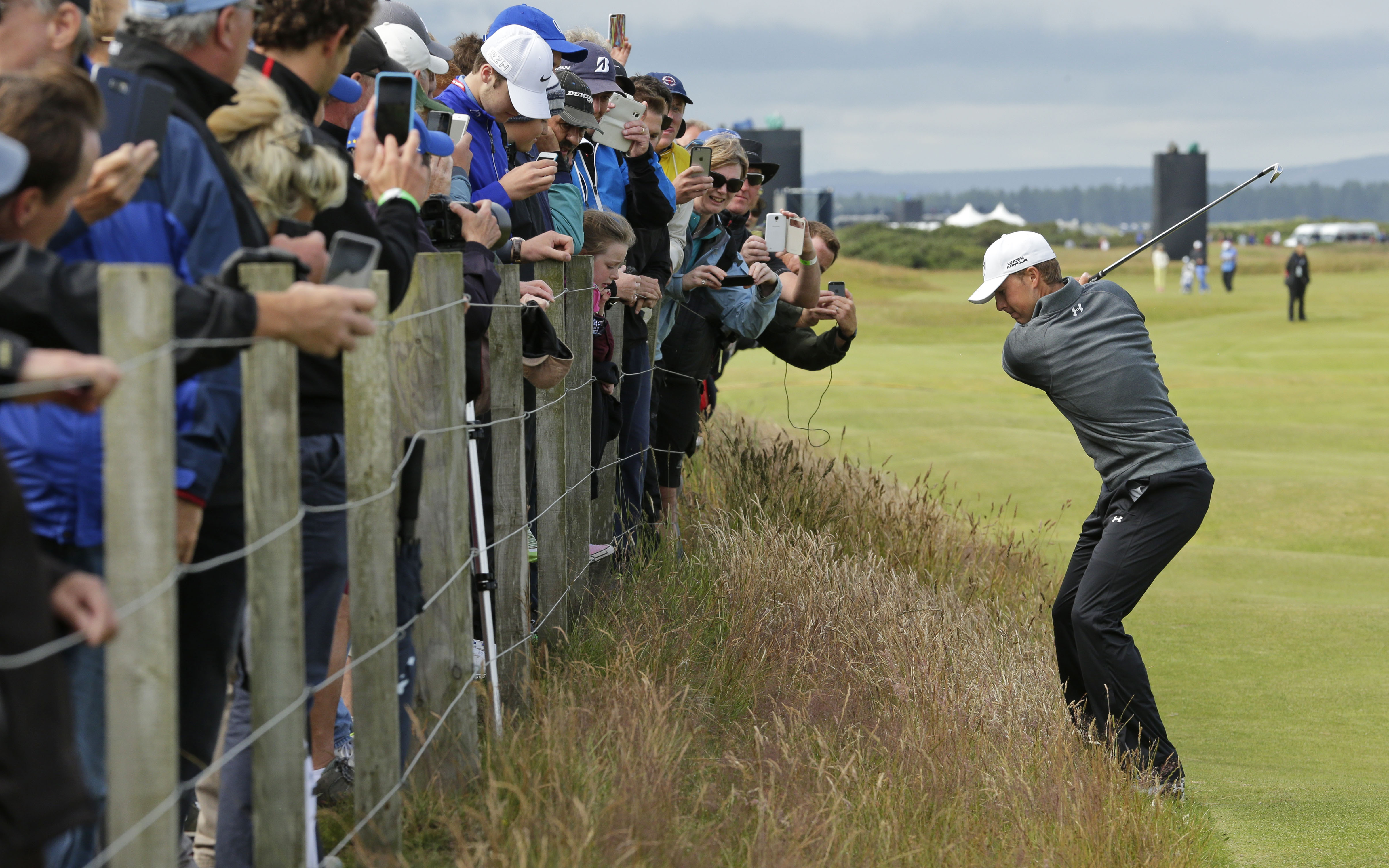 Jordan Spieth plays from the rough on hole 16 during a practice round at the British Open at St. Andrews. Photo: AP
